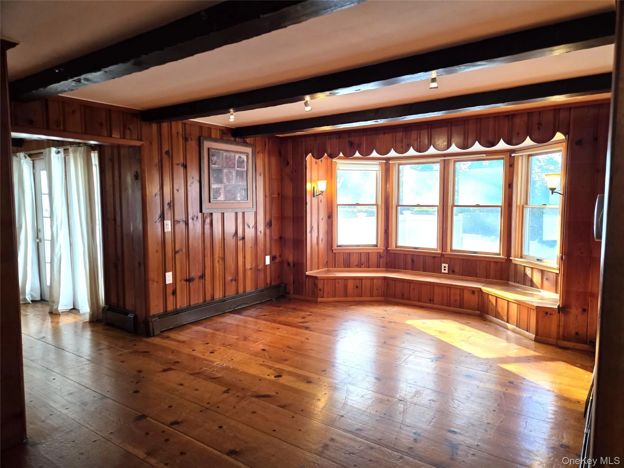 The Well Sized Formal Living Room (Or Perfect Formal Dining Room With It's Proximity To The Kitchen) Offers Original Vintage Beamed Ceilings, Wide Plank Hardwood Floors, Tongue & Groove Pine Walls, Large Windows For Natural Light & Ample Room For A Large Living Room Set/Furniture. The Well Sized Formal Living Room (Or Perfect Formal Dining Room With It's Proximity To The Kitchen) Offers Original Vintage Beamed Ceilings, Wide Plank Hardwood Floors, Tongue & Groove Pine Walls, Large Windows For Natural Light & Ample Room For A Large Living Room Set/Furniture.