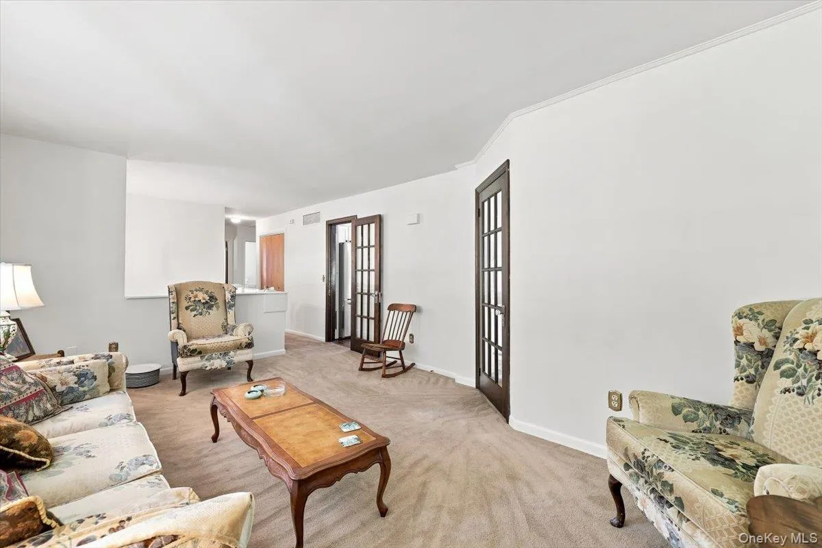 Large Living room with direct access to formal dining room and entrance foyer. Large Living room with direct access to formal dining room and entrance foyer.