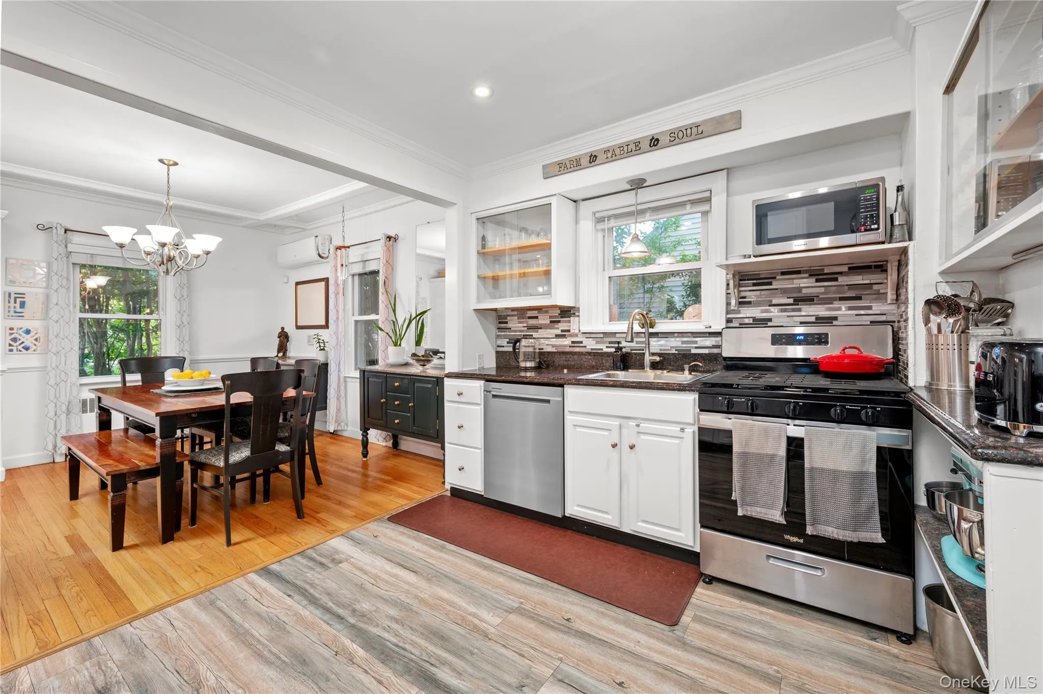 Open concept kitchen offering stainless steel appliances Open concept kitchen offering stainless steel appliances