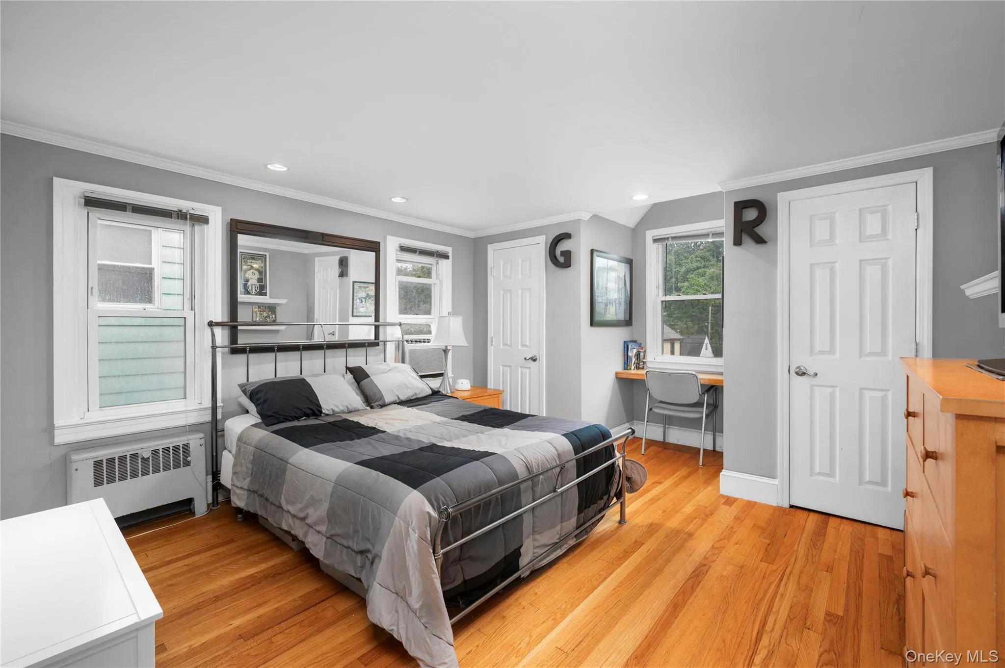 Bedroom #2 with hardwood floors and two closets Bedroom #2 with hardwood floors and two closets