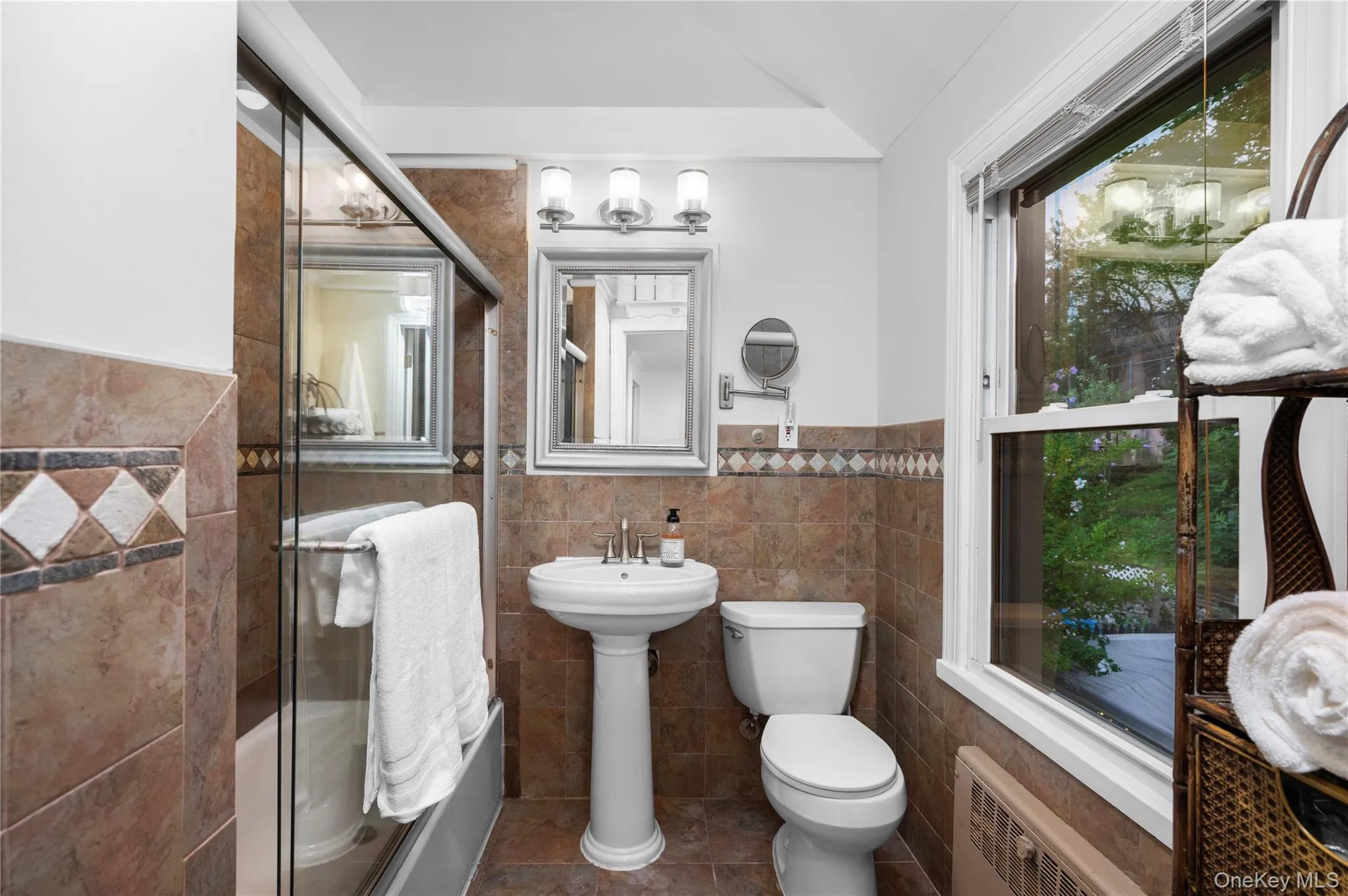 Second level full bathroom with bathtub. Skylights and cathedral ceiling Second level full bathroom with bathtub. Skylights and cathedral ceiling