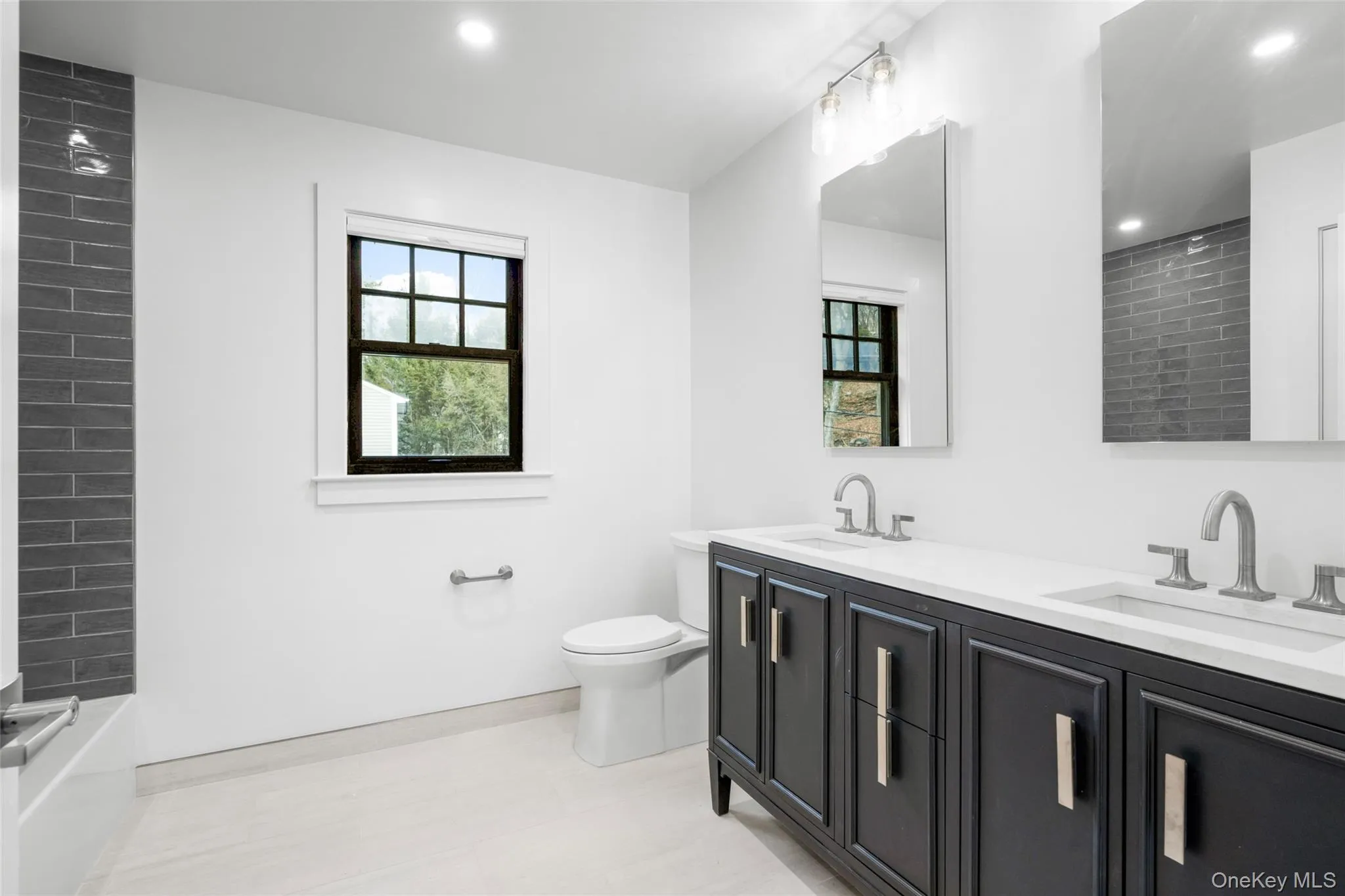2nd Floor - Hall bath with double sink, Tub/Shower. 2nd Floor - Hall bath with double sink, Tub/Shower.