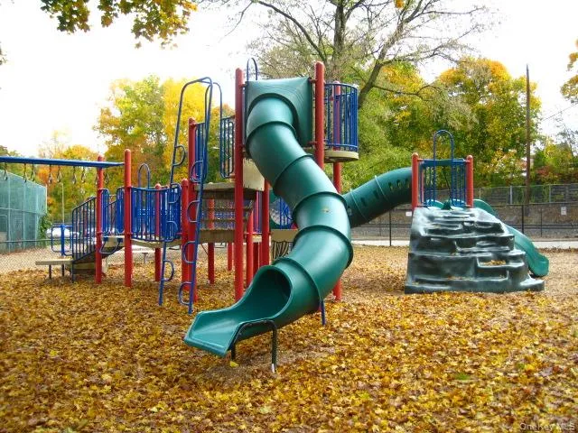 Garth Road Playground - Garth Road is a self contained tree lined street and 1/2 mile long starting at the Scarsdale Metro North Train Station and ending at the ball field. Easy walk to Scarsdale village and train. It's only a 33 minute train ride to Grand Central Terminal. As a resident you are entitled to join the Town’s Lake Isle Park, that features a Par 70, 18 hole golf course, 8 Tennis courts and 5 swimming pools including a 50 meter Olympic Pool with eight racing lanes. Garth Road Playground - Garth Road is a self contained tree lined street and 1/2 mile long starting at the Scarsdale Metro North Train Station and ending at the ball field. Easy walk to Scarsdale village and train. It's only a 33 minute train ride to Grand Central Terminal. As a resident you are entitled to join the Town’s Lake Isle Park, that features a Par 70, 18 hole golf course, 8 Tennis courts and 5 swimming pools including a 50 meter Olympic Pool with eight racing lanes.