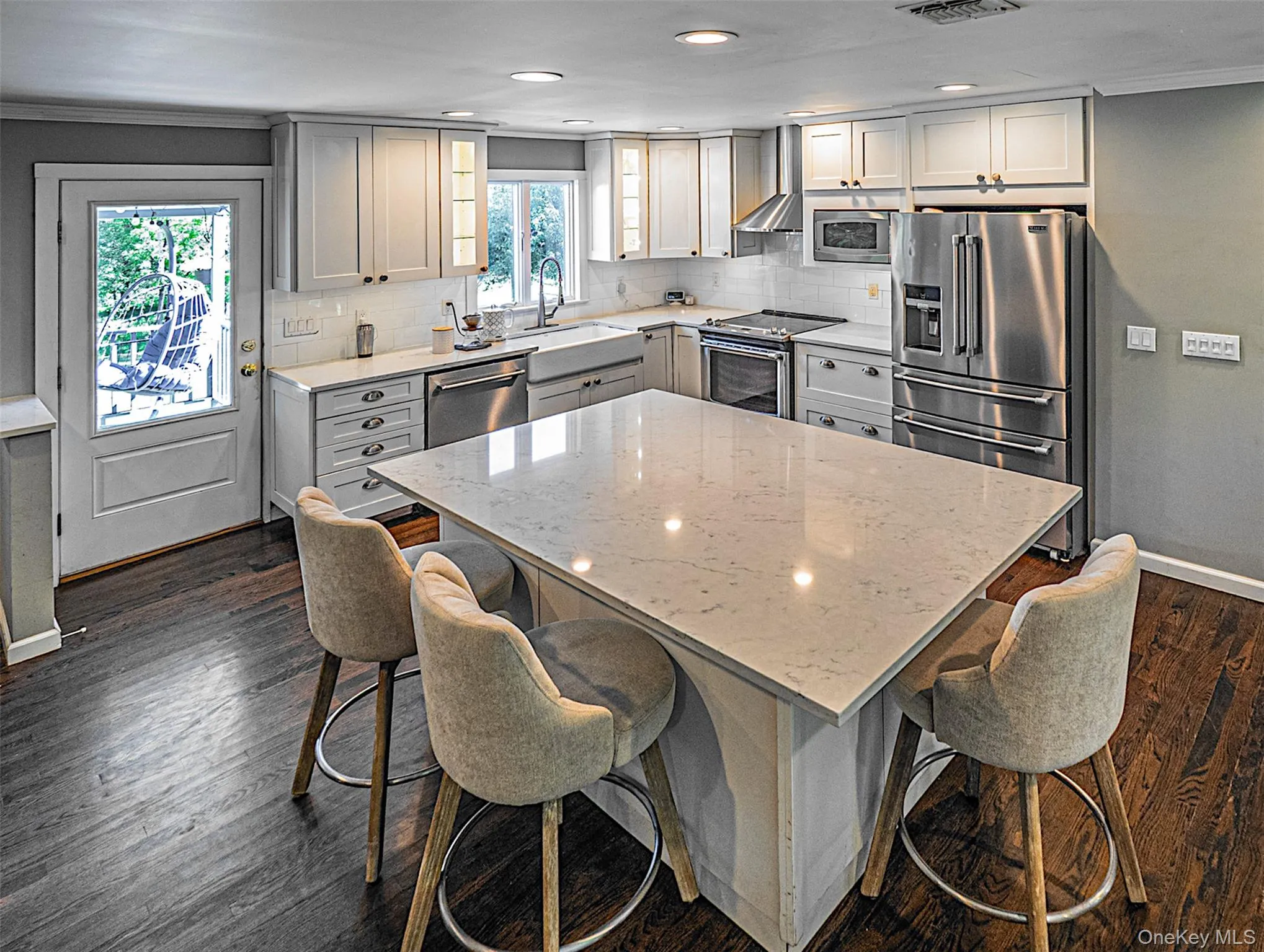 Spacious kitchen with plenty of counter space and cabinet storage. Island has a wine refrigerator. Spacious kitchen with plenty of counter space and cabinet storage. Island has a wine refrigerator.