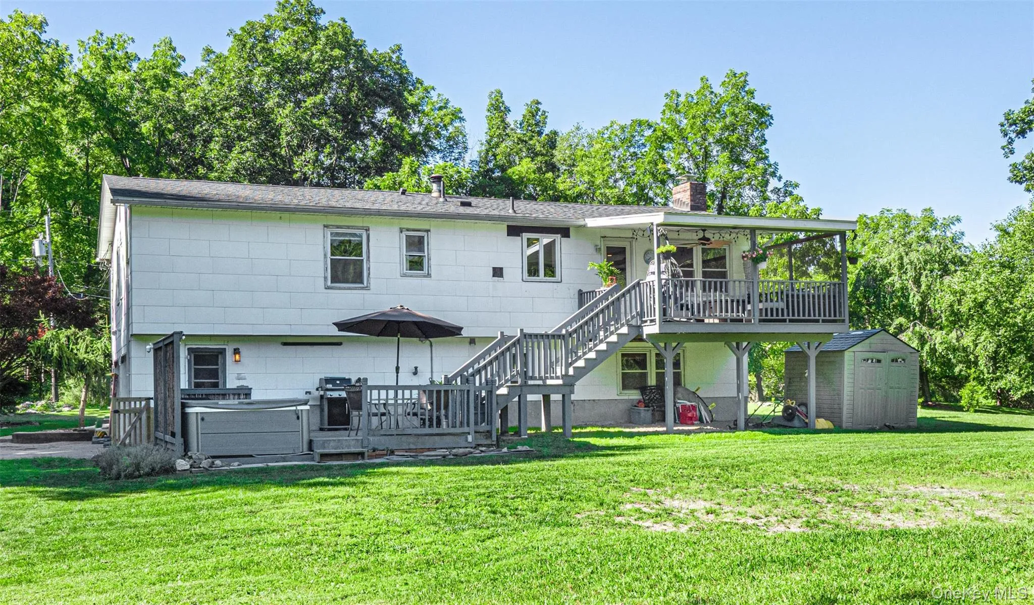 Long view of upper and lower deck with backyard perspective. Long view of upper and lower deck with backyard perspective.