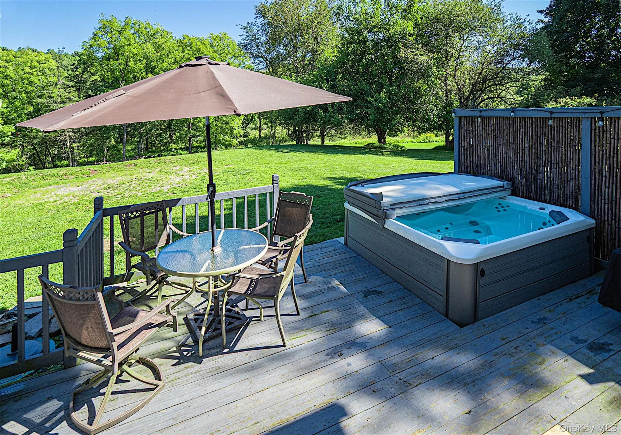Lower deck with built in hot tub. Lower deck with built in hot tub.