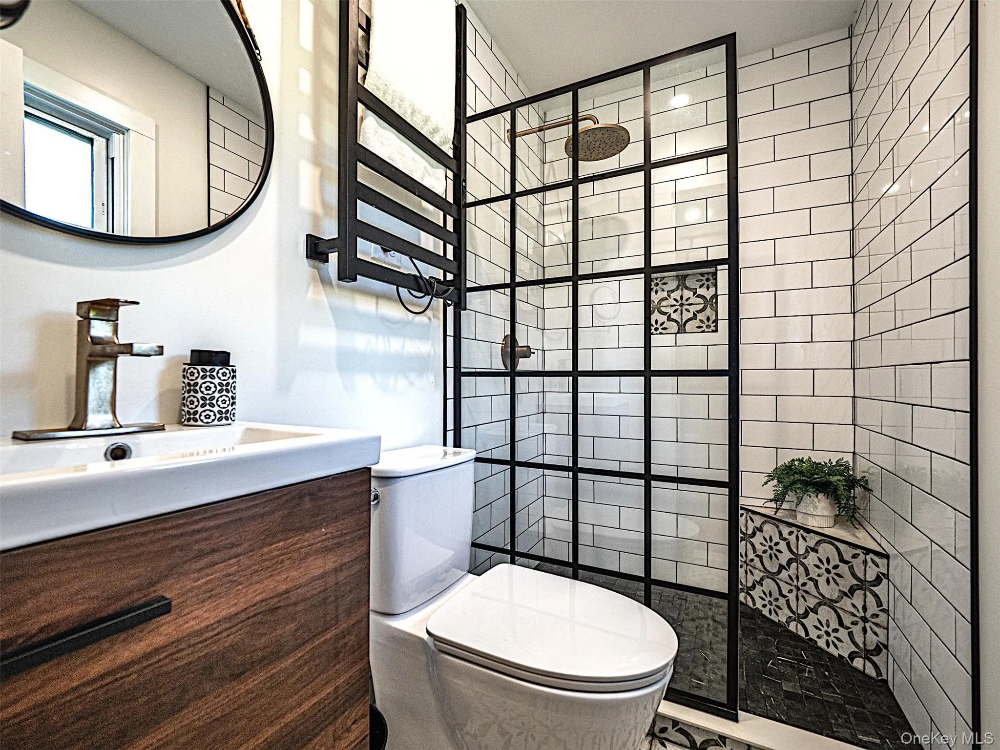 Newly renovated bathroom with towel warming rack. Newly renovated bathroom with towel warming rack.