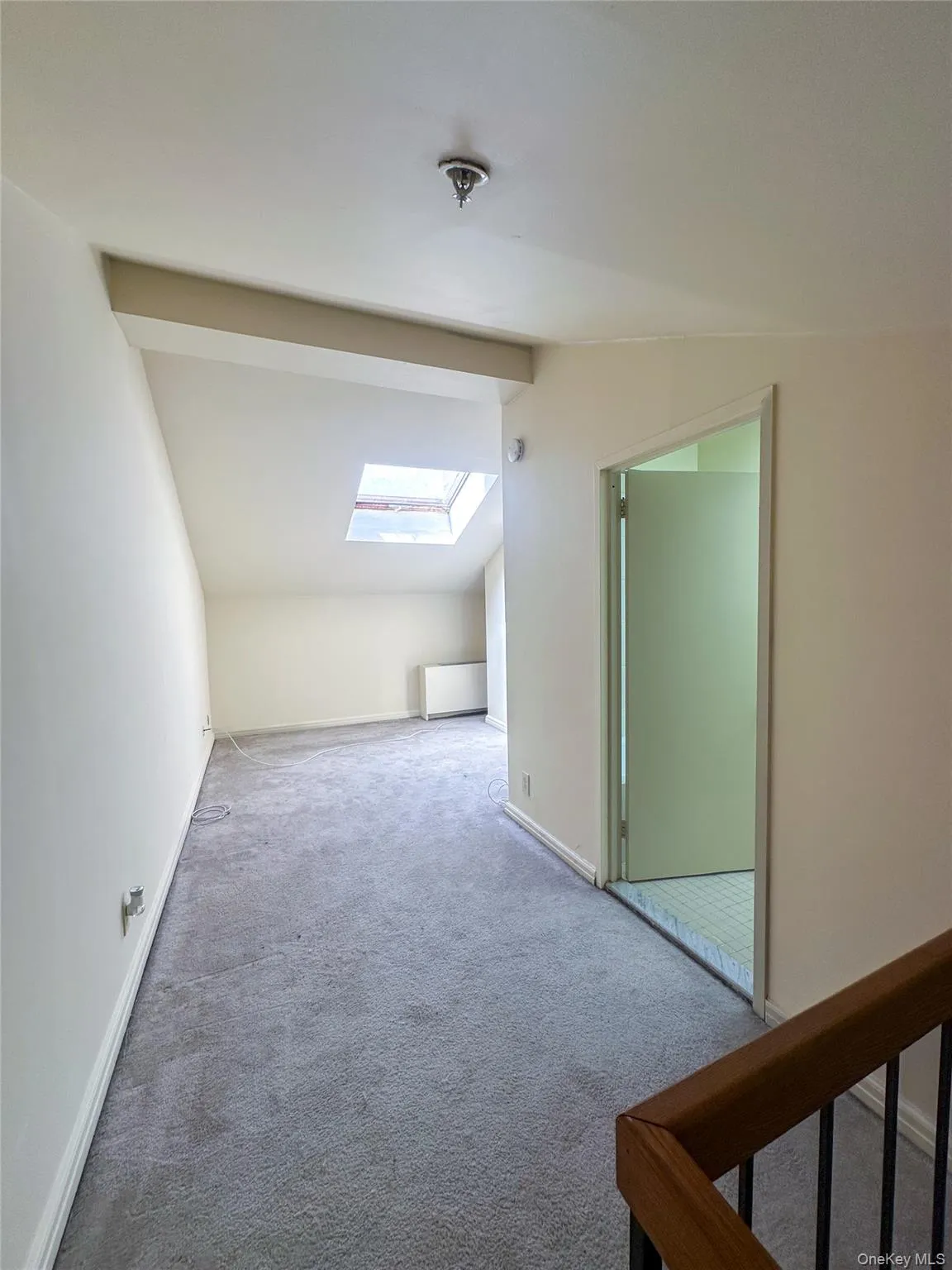 Loft bedroom offers an open and airy feel with generous ceiling height and carpeting. Loft bedroom offers an open and airy feel with generous ceiling height and carpeting.