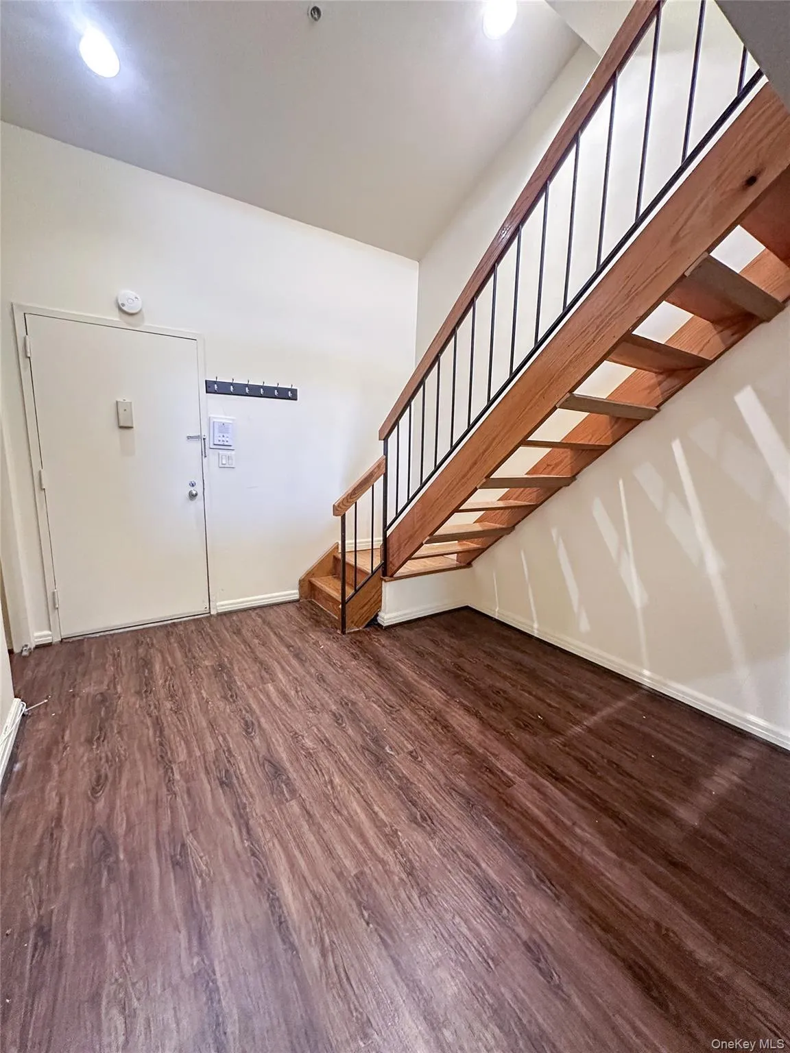 Open foyer and staircase create an airy transition between the main living area and loft level. Open foyer and staircase create an airy transition between the main living area and loft level.