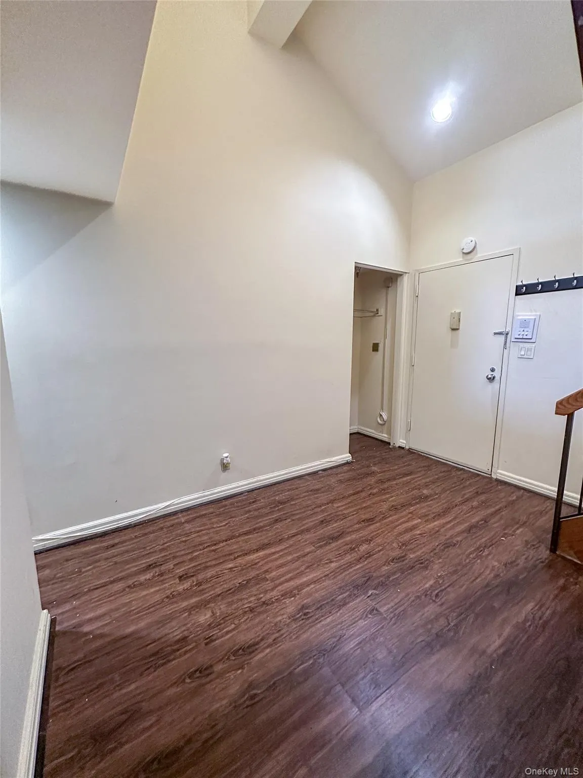 Bright entry foyer with soaring ceilings and staircase leading to the loft-style bedroom. Bright entry foyer with soaring ceilings and staircase leading to the loft-style bedroom.