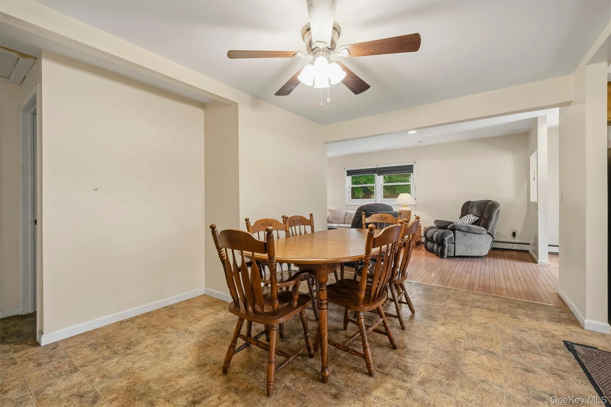 Dining area featuring a ceiling fan with light fixture. Dining area featuring a ceiling fan with light fixture.