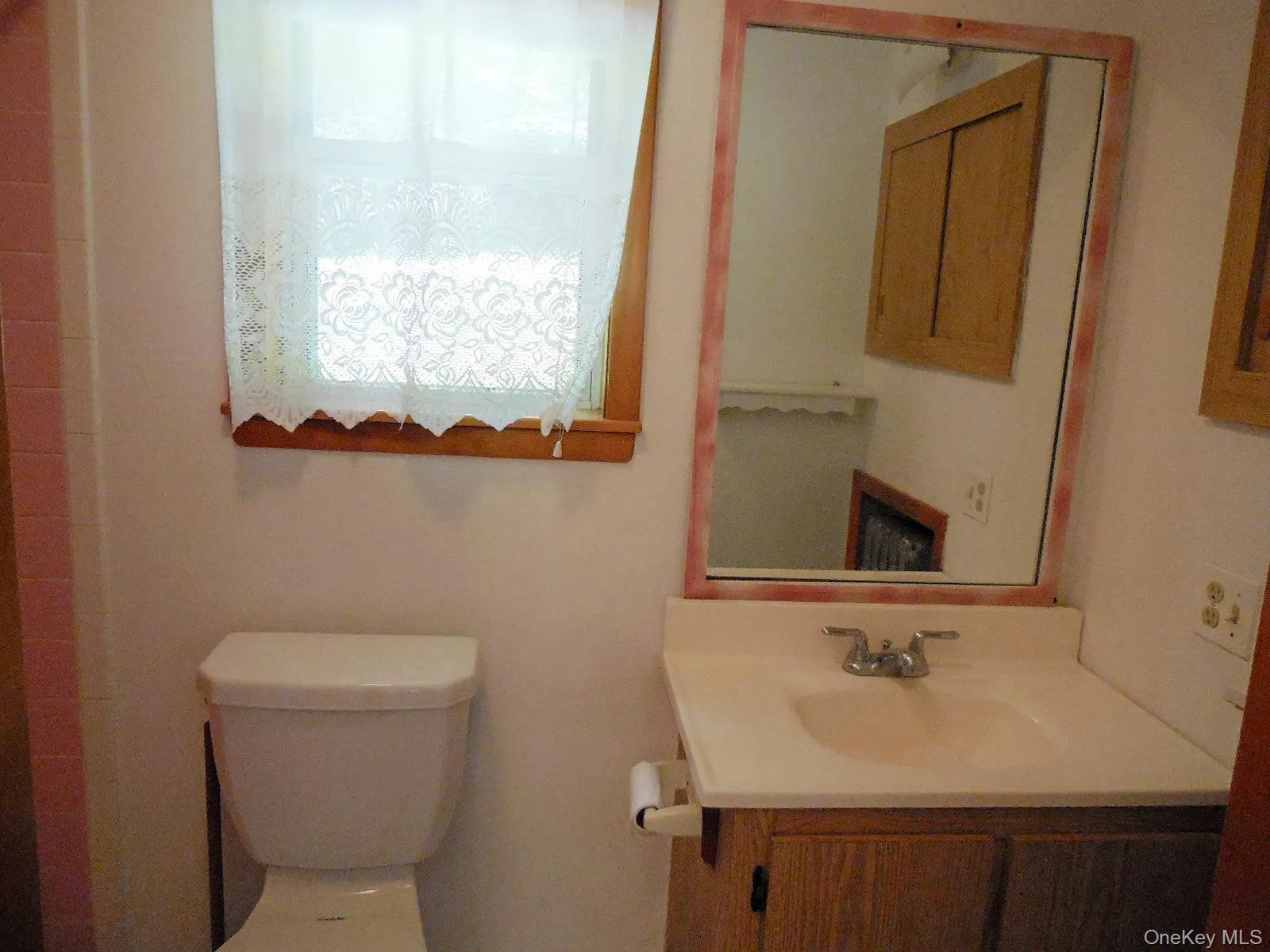 Full bathroom off laundry room with tiled shower and tiled flooring. Full bathroom off laundry room with tiled shower and tiled flooring.