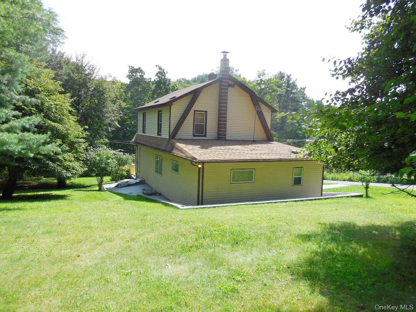 Back Yard & view of home with wrap around sidewalk. Back Yard & view of home with wrap around sidewalk.