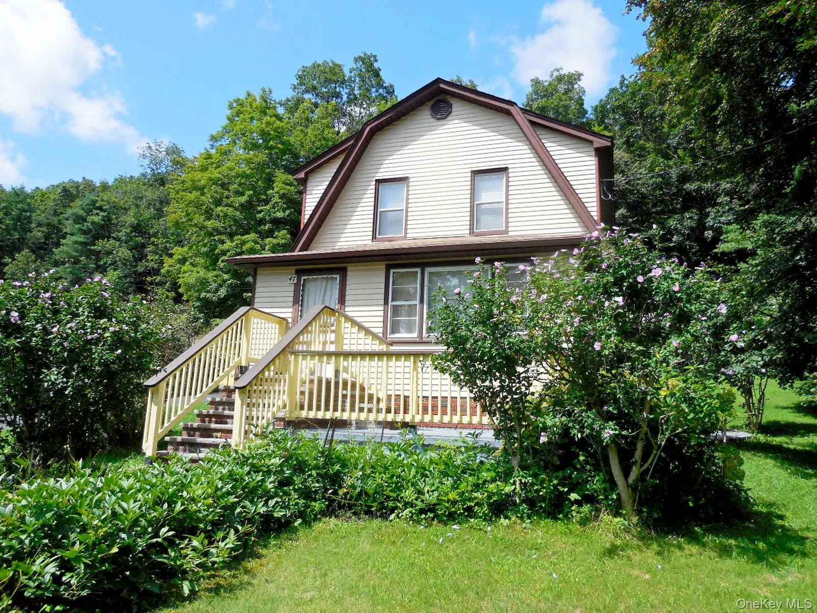 Mature landscaping, flowering trees. Mature landscaping, flowering trees.