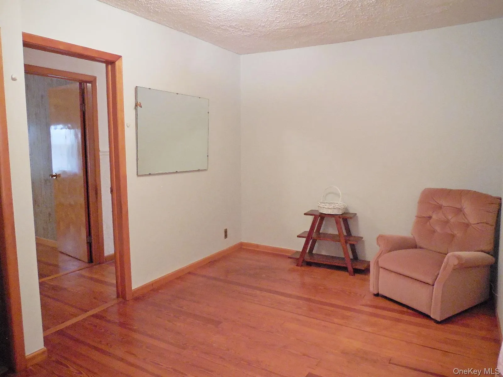 Bedrm 1. Wood-finish flooring throughout the space Bedrm 1. Wood-finish flooring throughout the space