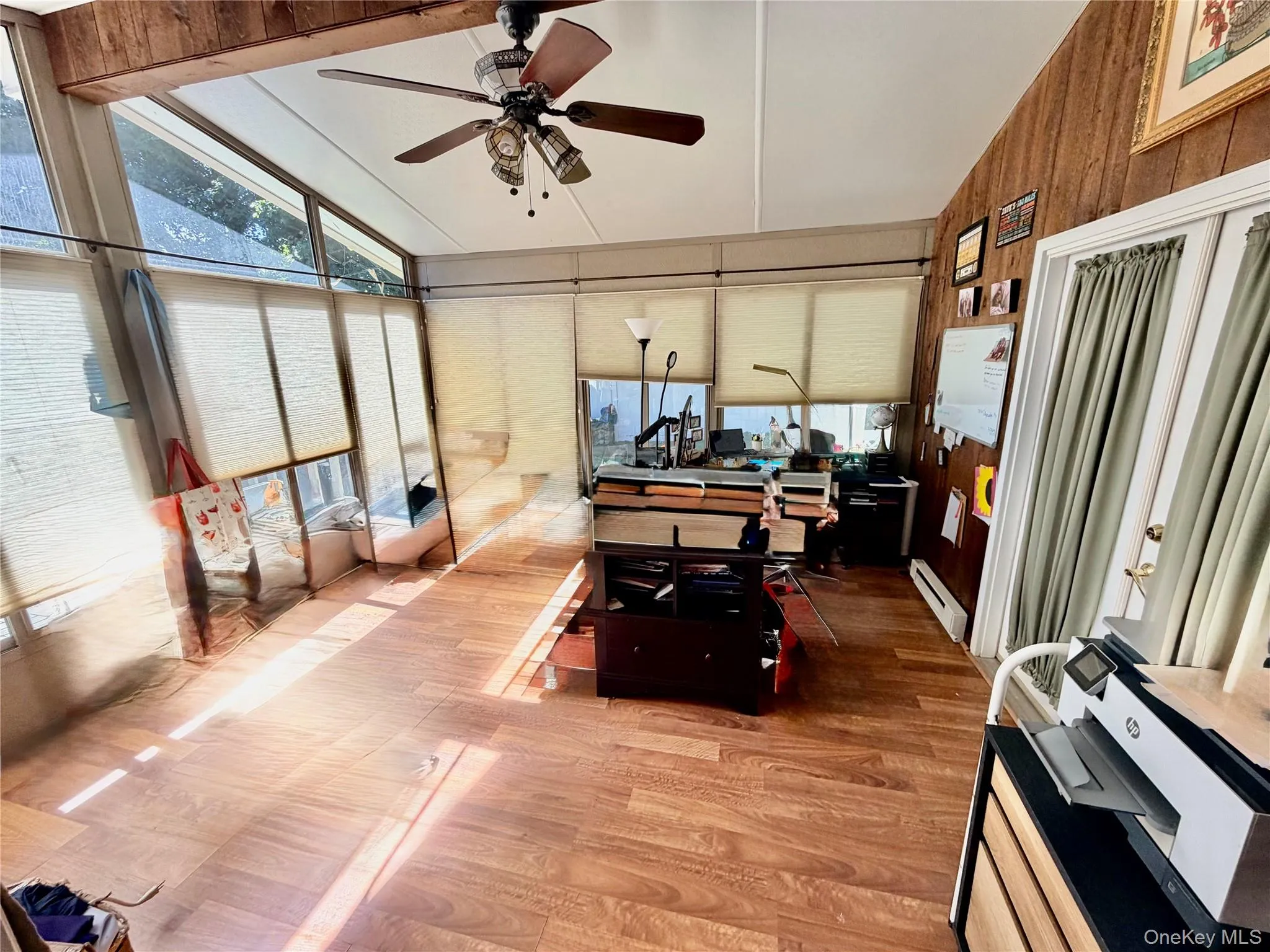 Large spacious den with high ceilings and plenty of light Large spacious den with high ceilings and plenty of light
