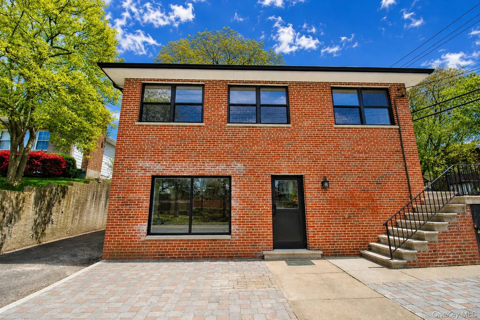 Ground level entrancewith patio and driveway Ground level entrancewith patio and driveway