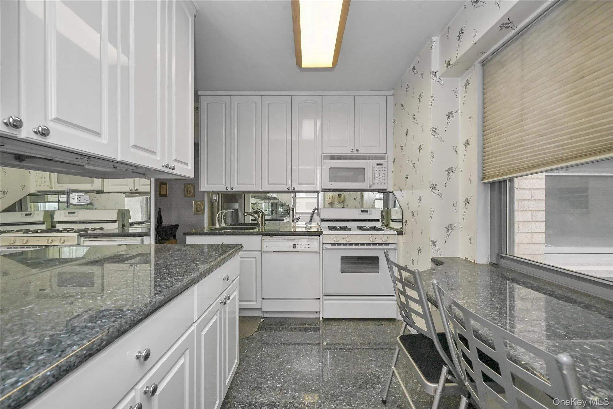 This kitchen boasts granite countertops and an eat-in area. This kitchen boasts granite countertops and an eat-in area.