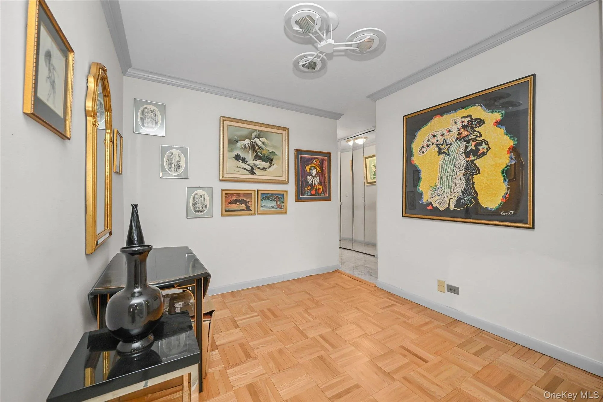Foyer with parquet floors opens into an expansive living room Foyer with parquet floors opens into an expansive living room