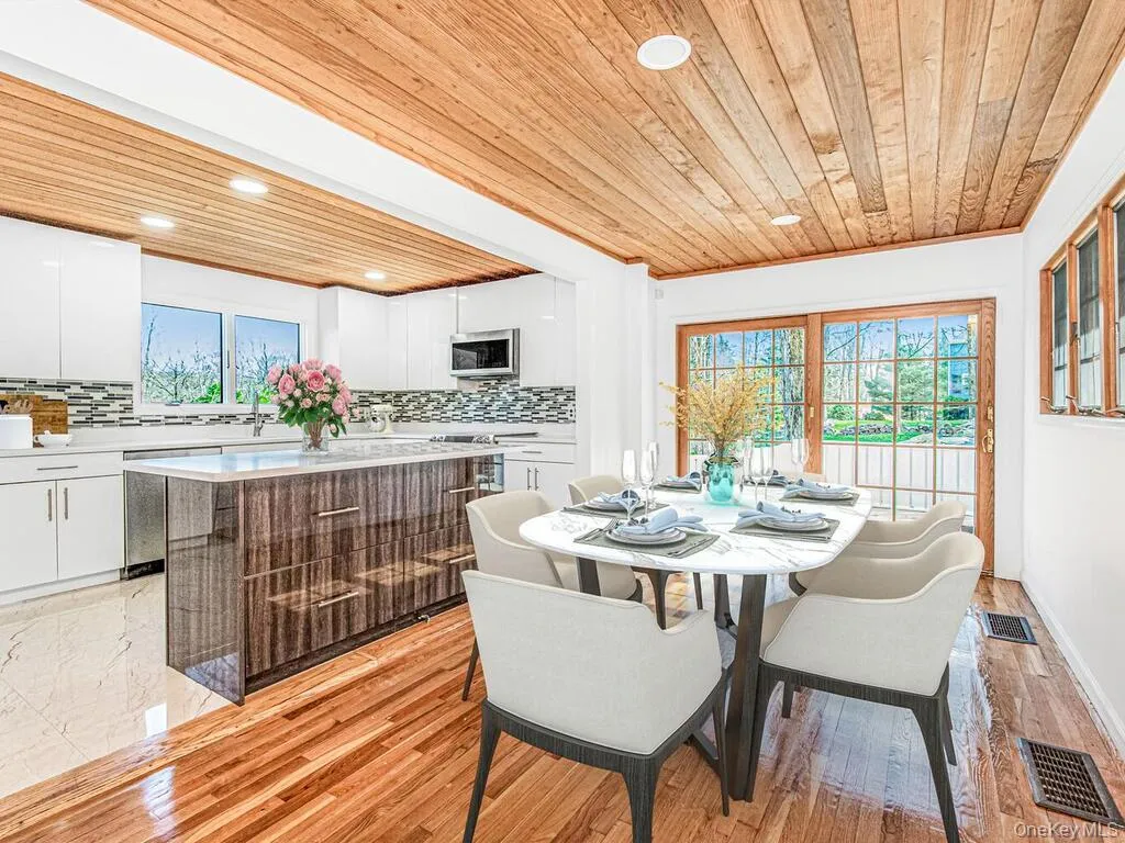 Dining area, modern kitchen and island Dining area, modern kitchen and island