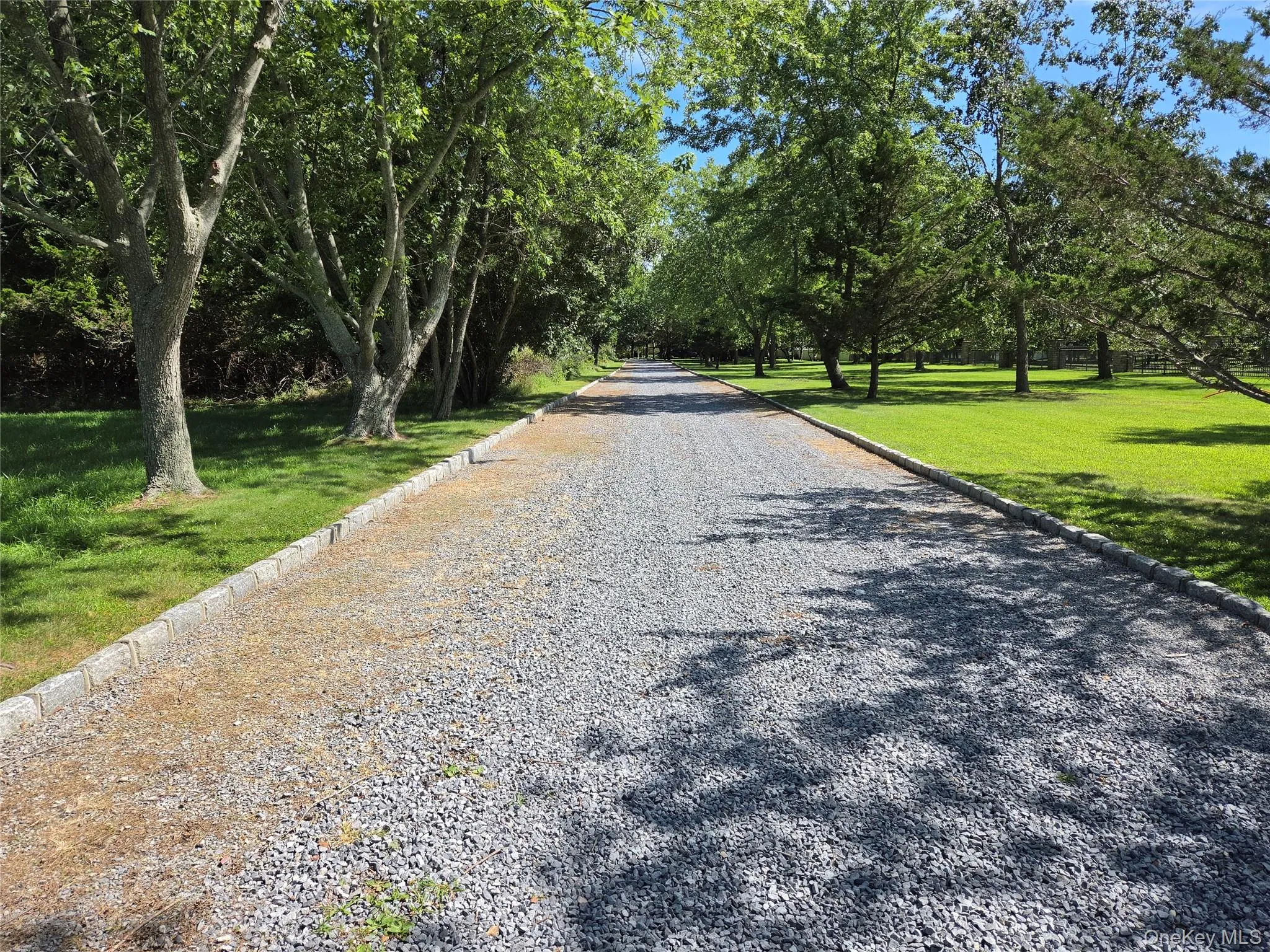 Elegant drive through the gates to the beach parking lot. Elegant drive through the gates to the beach parking lot.