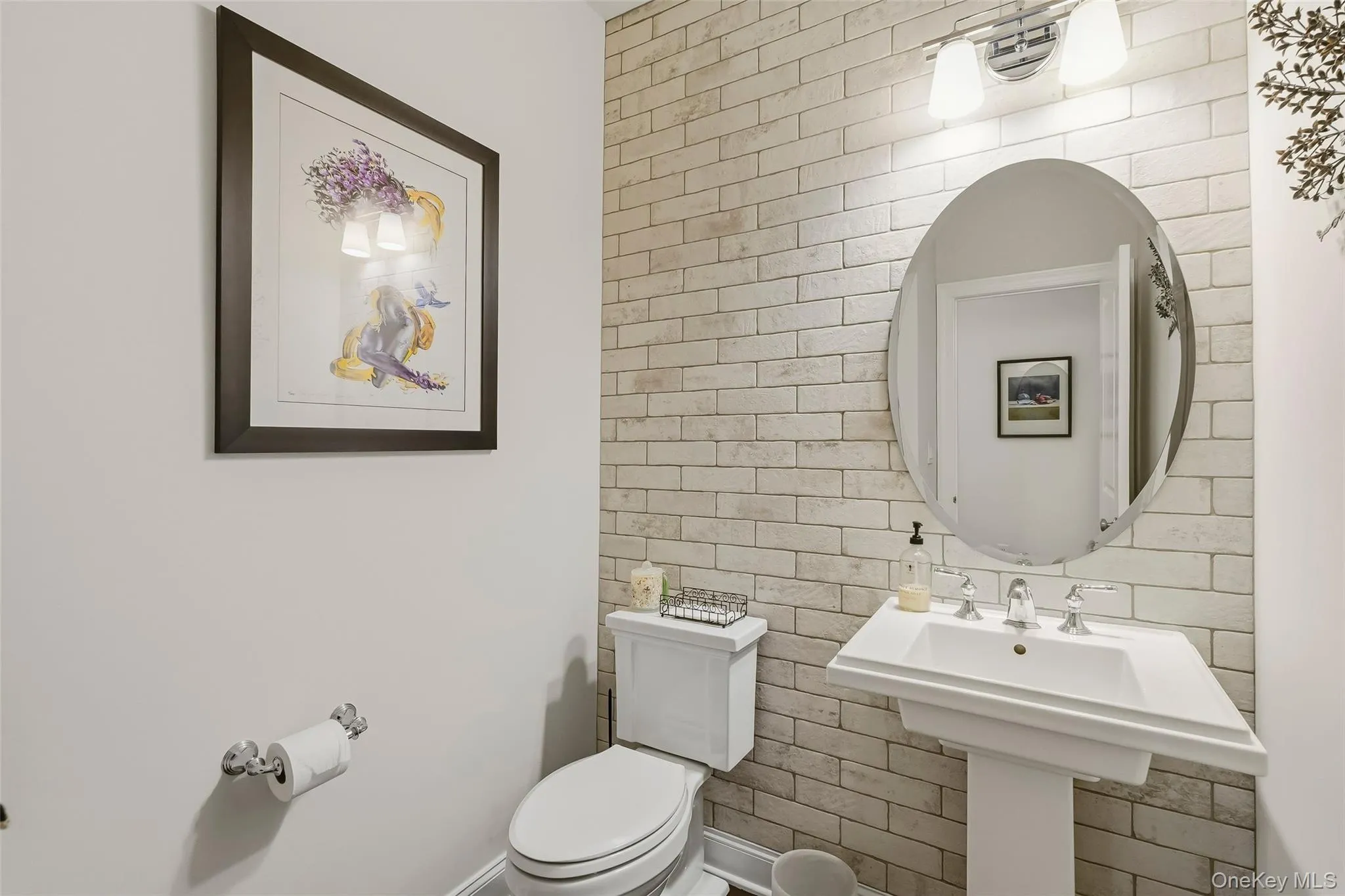 Half bath on main floor with accent wall Half bath on main floor with accent wall