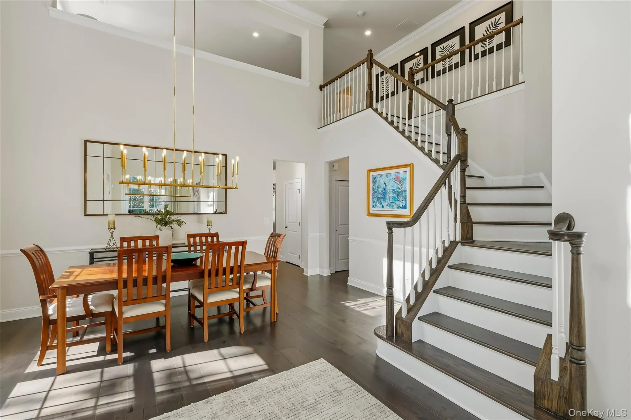 Enter into the bright 2 story foyer with dining room on the left Enter into the bright 2 story foyer with dining room on the left