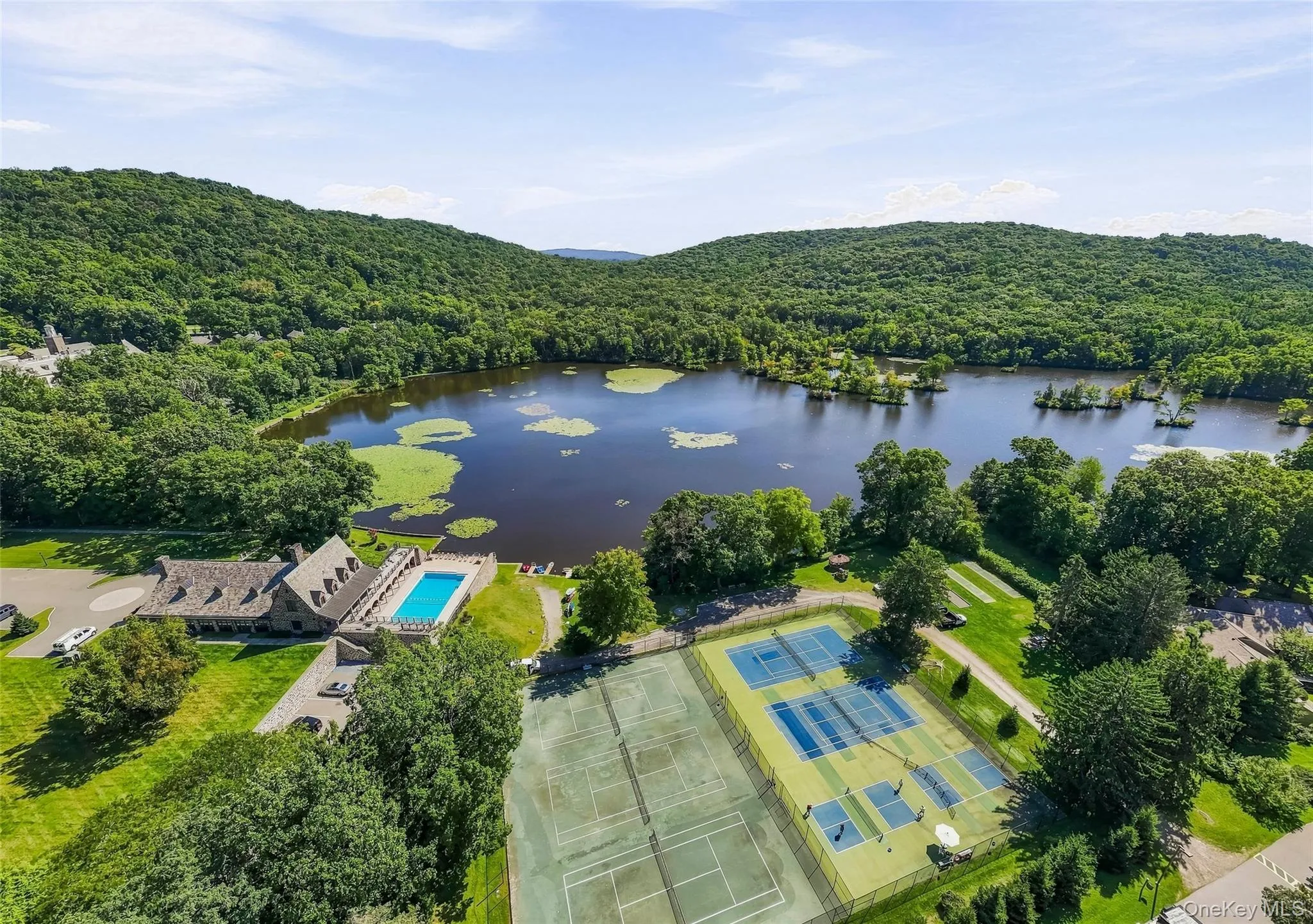 Tennis and pickleball courts and walking trails around the lake Tennis and pickleball courts and walking trails around the lake