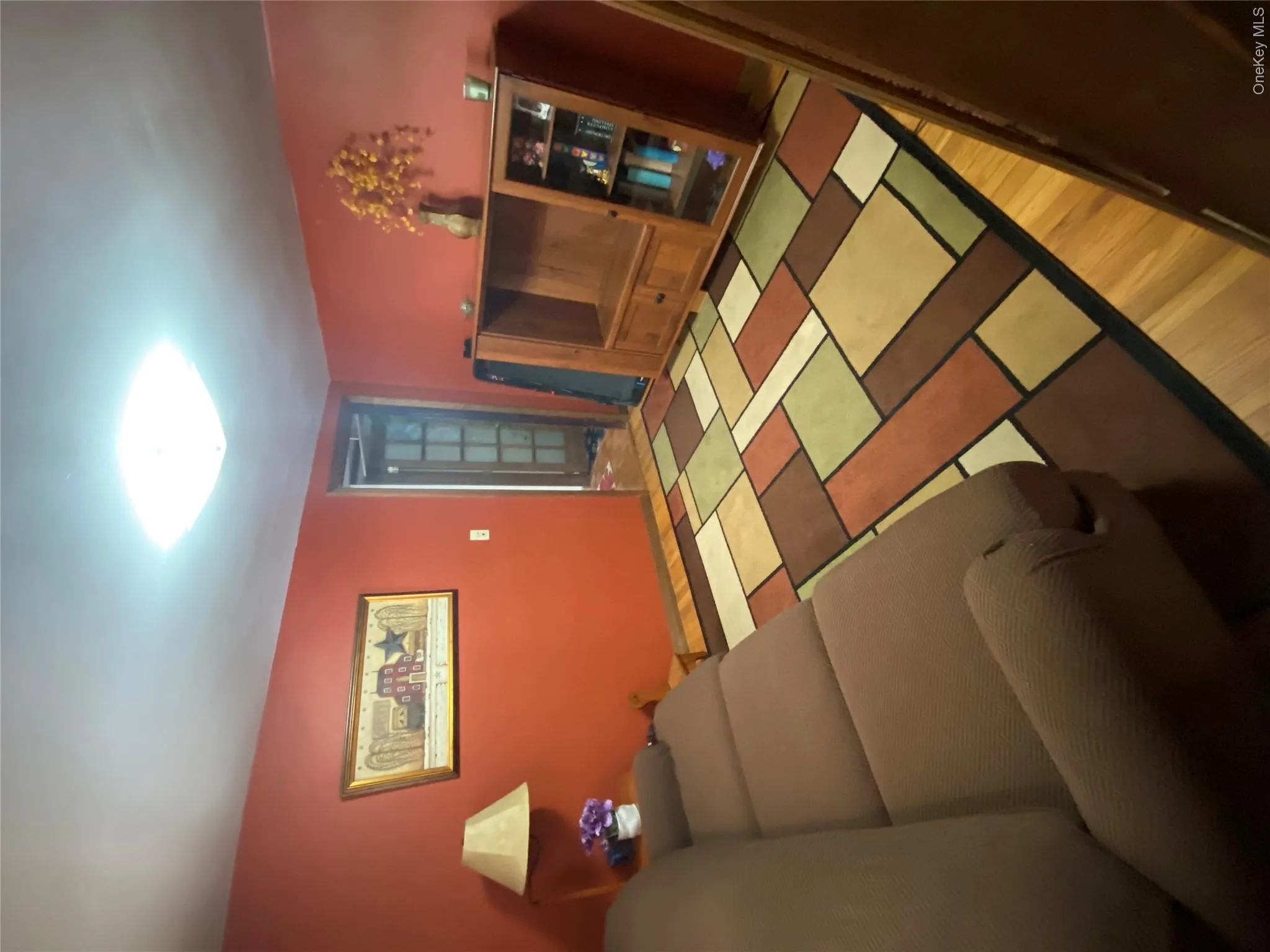 Wood-finish flooring with a flush-mount ceiling light Wood-finish flooring with a flush-mount ceiling light