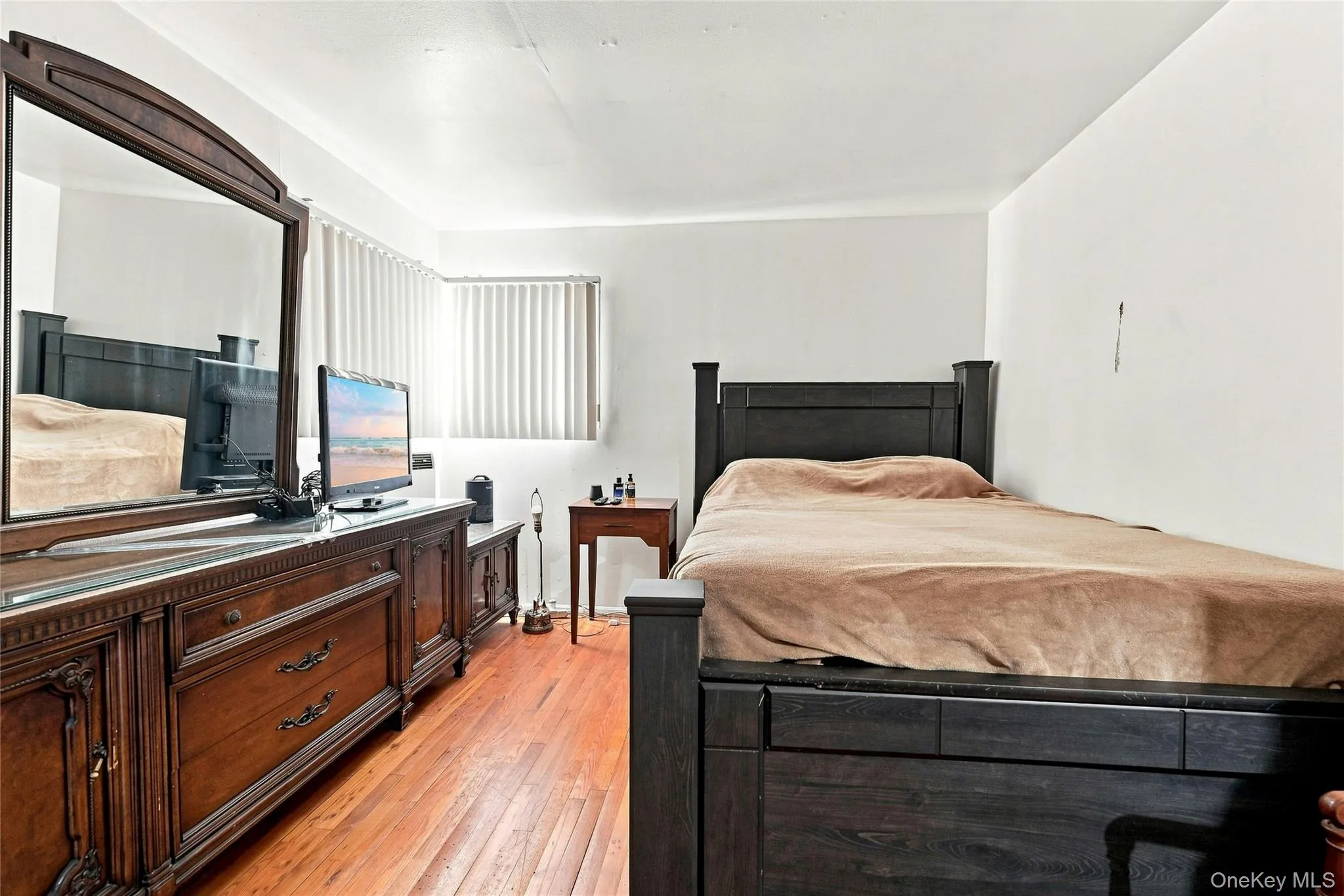 The Well Sized, Comfortable Primary Bedroom Offers Hardwood Floors, Double Corner Windows For Natural Light, Good Sized Closet & Ample Room For Furniture. The Well Sized, Comfortable Primary Bedroom Offers Hardwood Floors, Double Corner Windows For Natural Light, Good Sized Closet & Ample Room For Furniture.