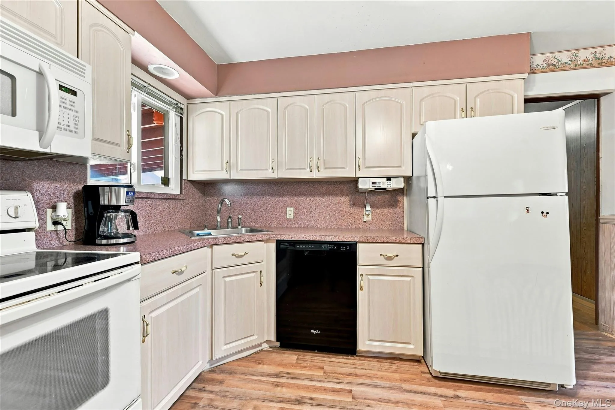 The Cabinet Lined Kitchen Offers Two Walls Of Cabinetry, Ample Counter/Serving Space & A Large Window For Natural Light (Overlooks The Bacykard) The Cabinet Lined Kitchen Offers Two Walls Of Cabinetry, Ample Counter/Serving Space & A Large Window For Natural Light (Overlooks The Bacykard)