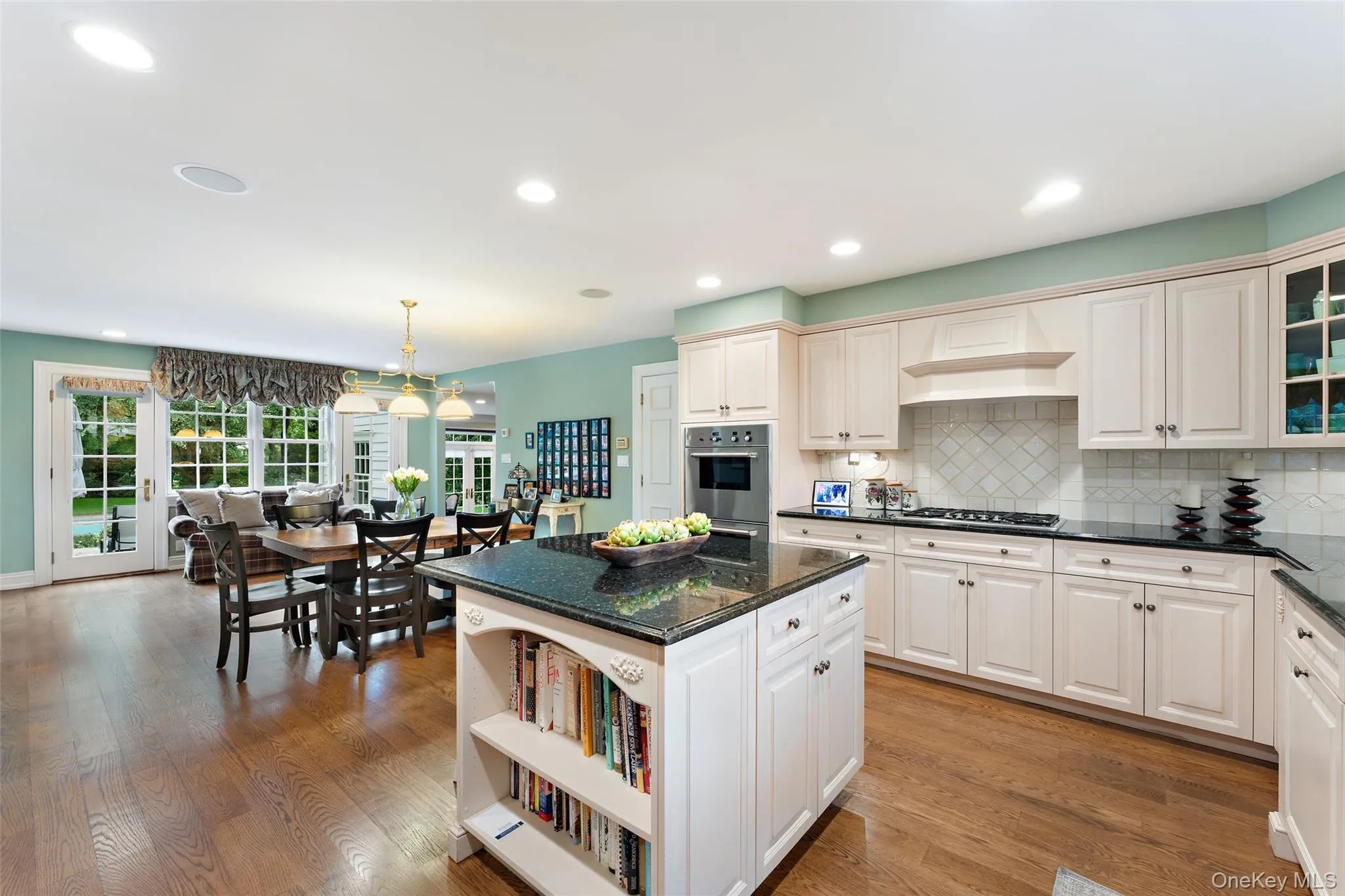 Gourmet Kitchen with custom cabinetry and center island overlooking breakfast area Gourmet Kitchen with custom cabinetry and center island overlooking breakfast area