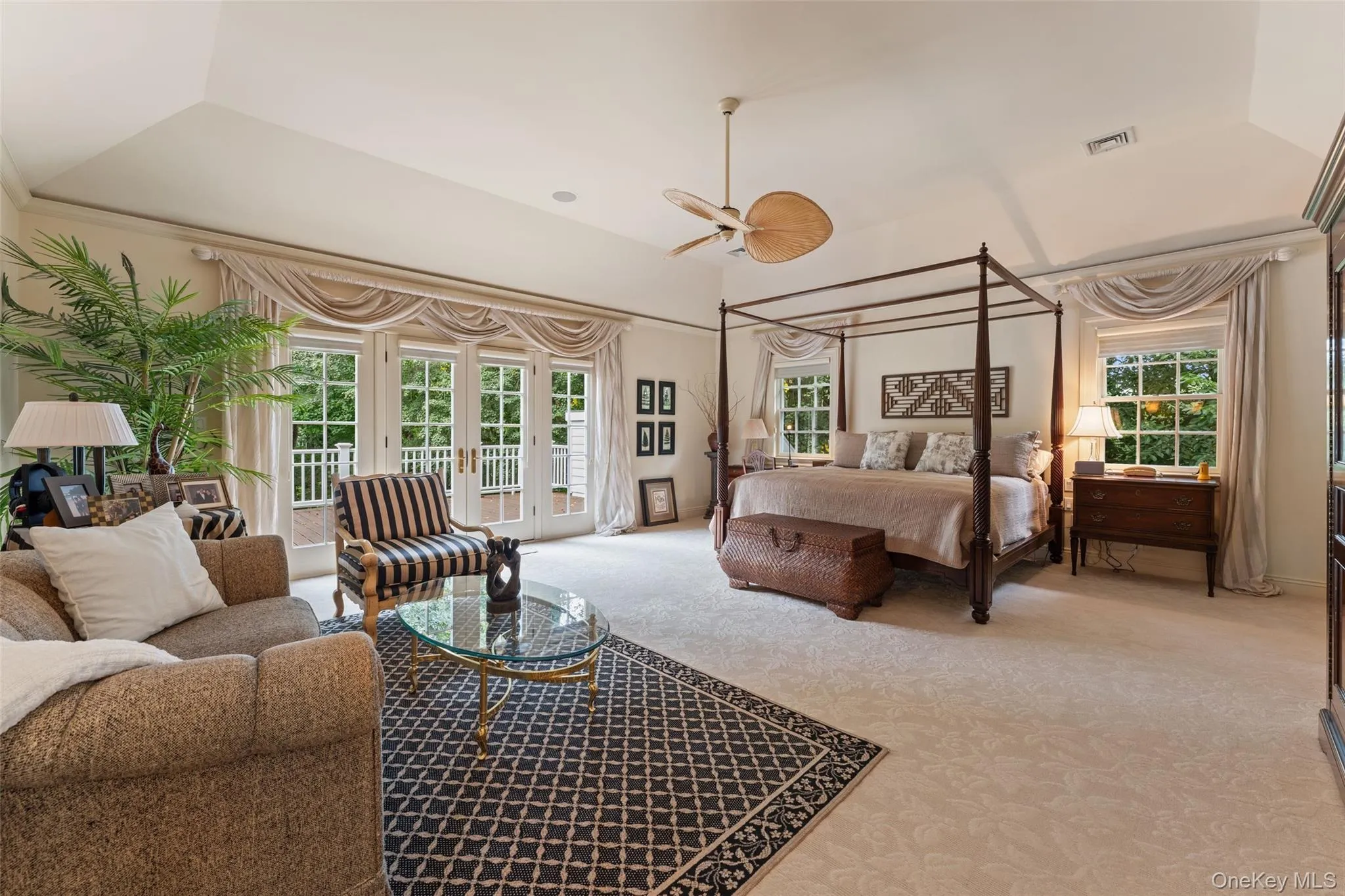 Primary Bedroom with vaulted ceiling and balcony overlooking property Primary Bedroom with vaulted ceiling and balcony overlooking property