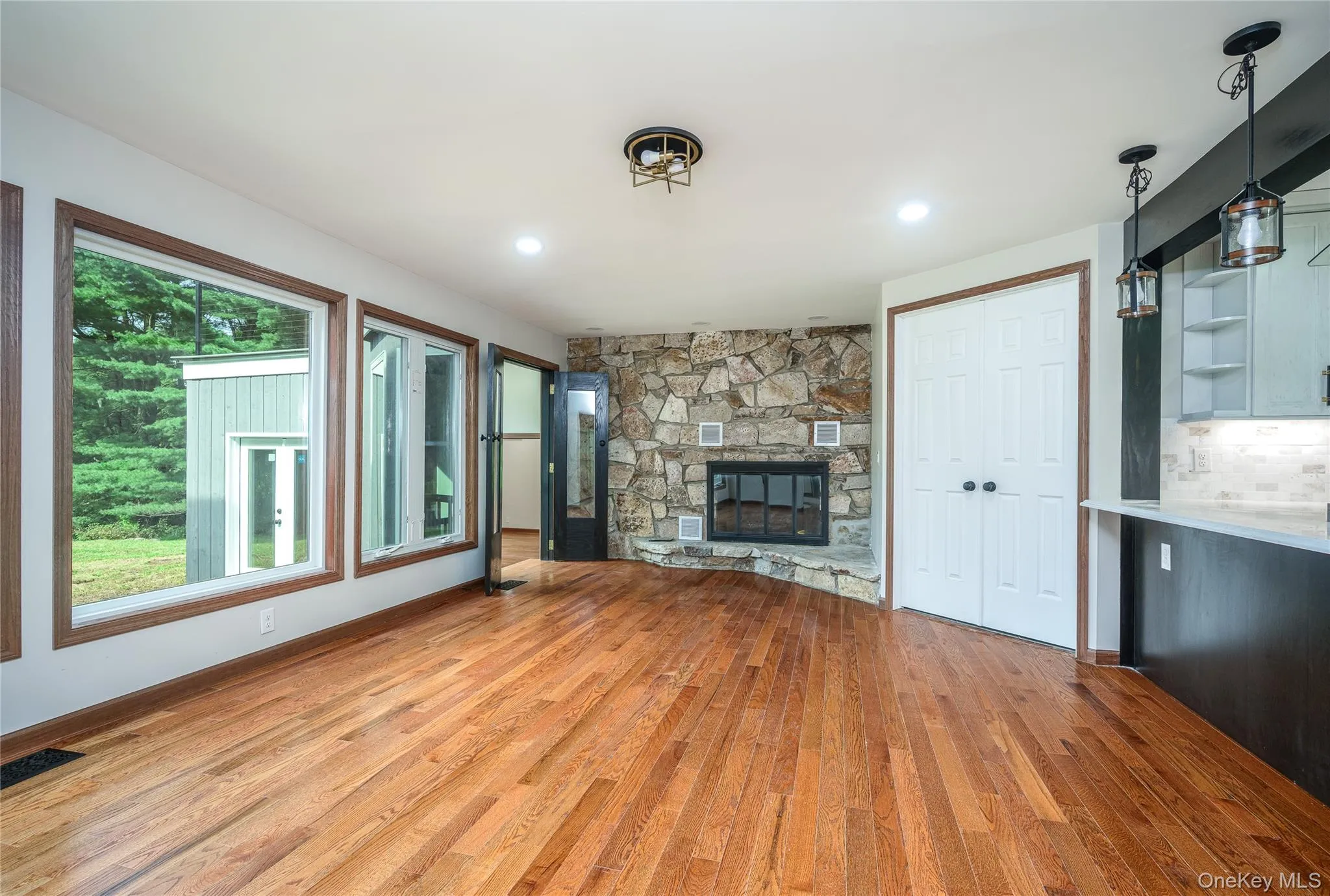 The dining room features a fireplace and is located off the kitchen to the right and leads down the game room on the left. The dining room features a fireplace and is located off the kitchen to the right and leads down the game room on the left.