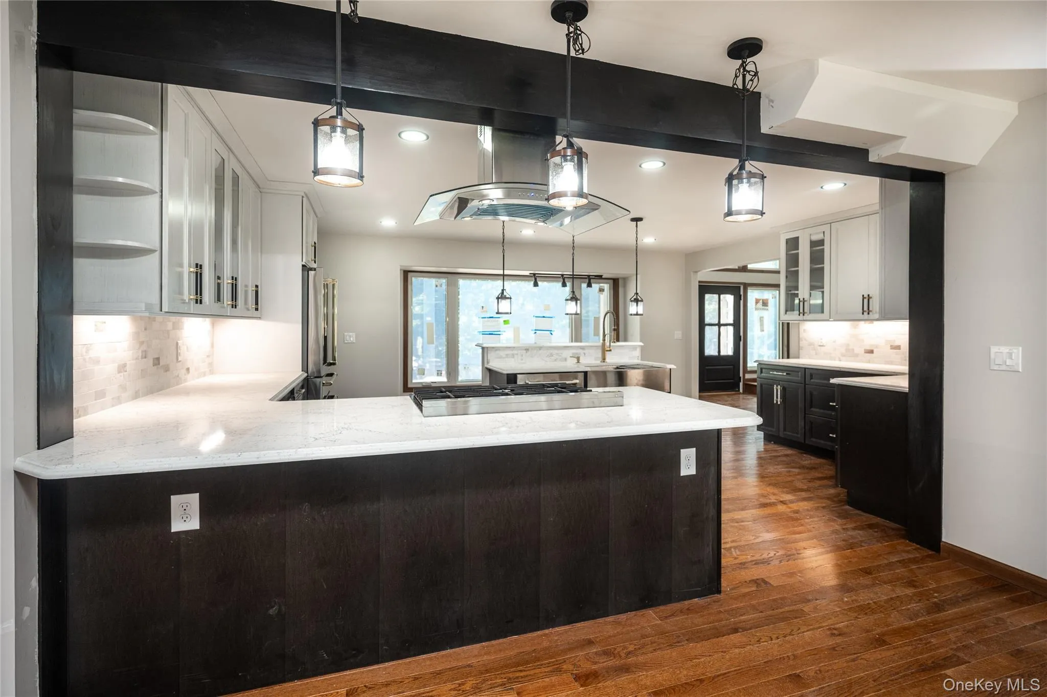 The open layout shows a view into the kitchen from the dining room The open layout shows a view into the kitchen from the dining room