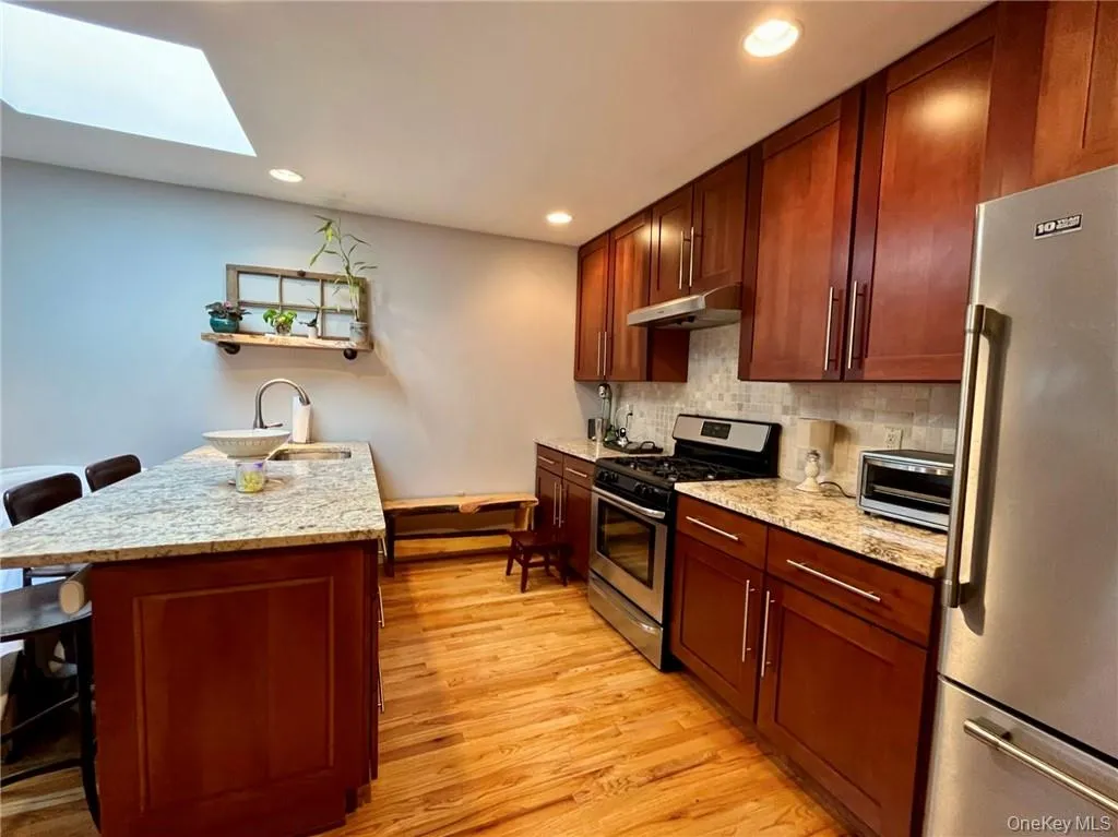 Large kitchen with granite counters and wood floors Large kitchen with granite counters and wood floors