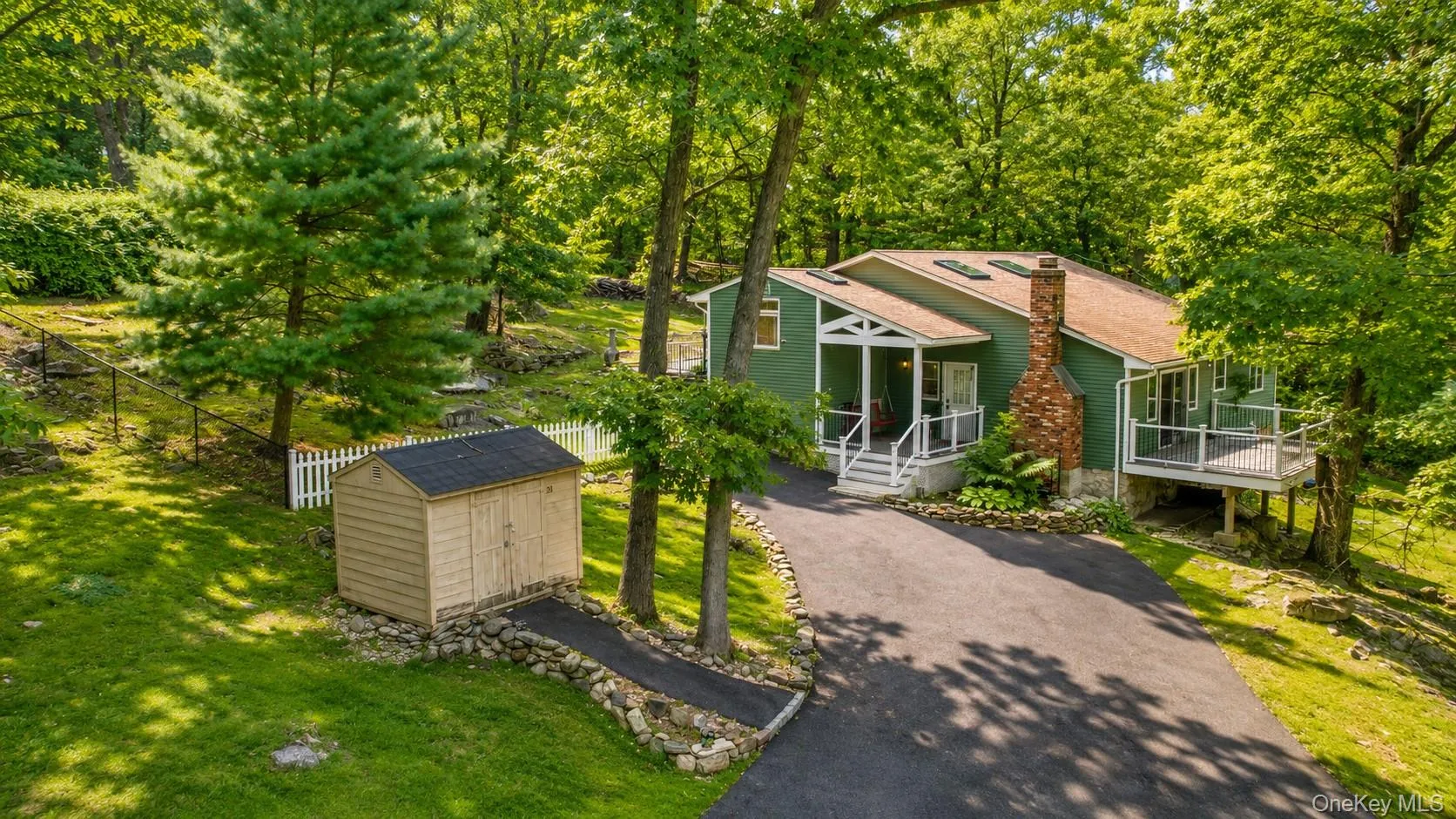 Aerial views showcase this one-of-a-kind Lake Peekskill home, set in a spectacular setting with the rare convenience of parking for 10+ cars. Aerial views showcase this one-of-a-kind Lake Peekskill home, set in a spectacular setting with the rare convenience of parking for 10+ cars.
