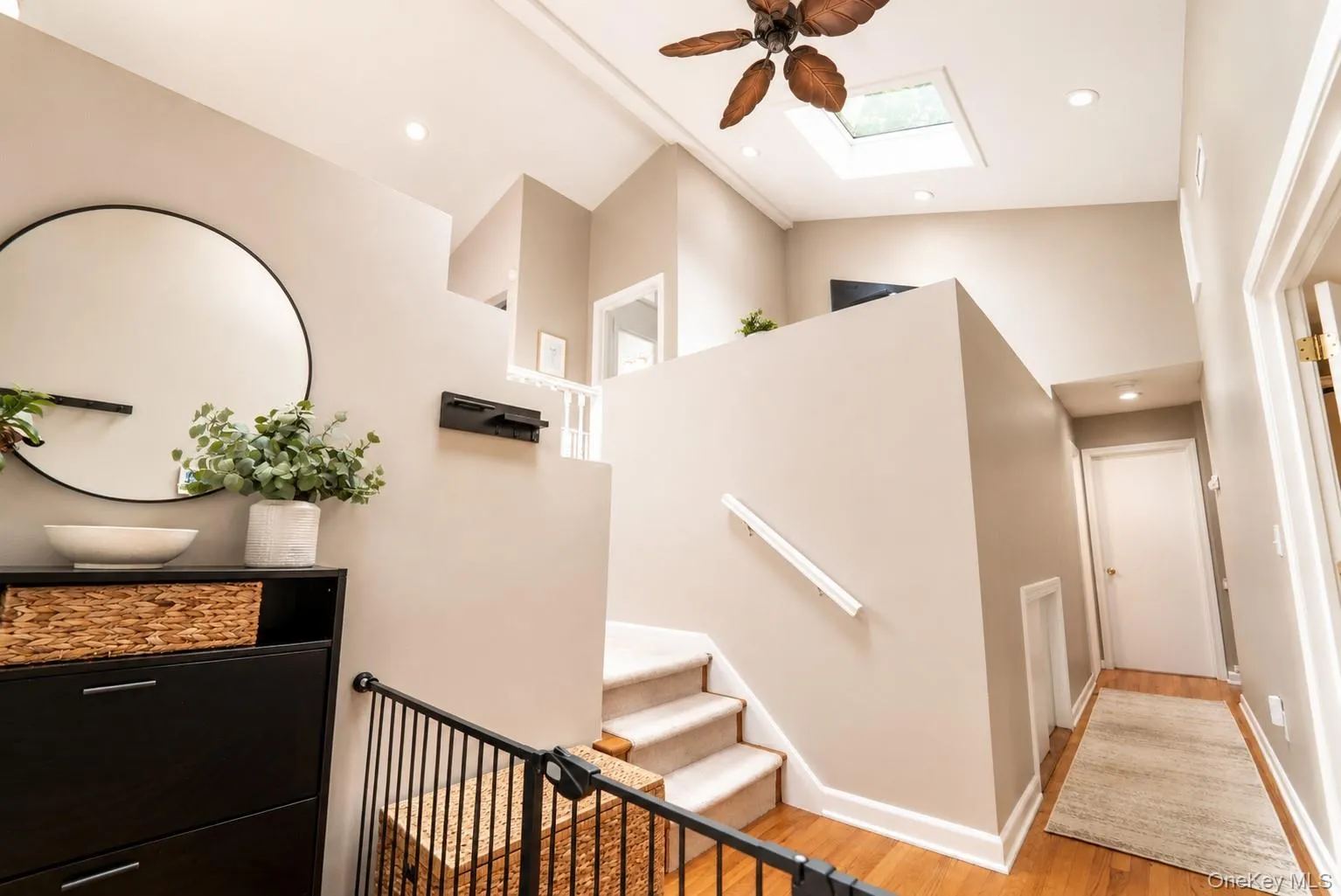 The inviting foyer features soaring ceilings and an abundance of natural light streaming through the skylights, creating a bright and welcoming first impression. The inviting foyer features soaring ceilings and an abundance of natural light streaming through the skylights, creating a bright and welcoming first impression.