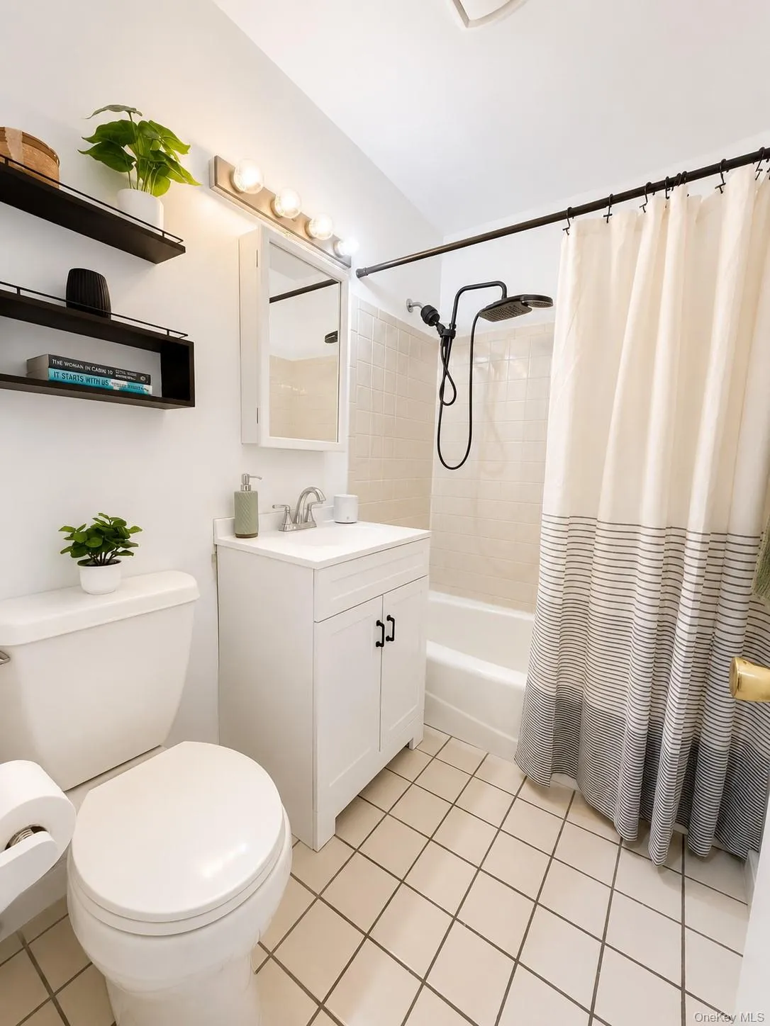 Hallway full bath with tub and designer shower feature adjacent secondary bedroom. Hallway full bath with tub and designer shower feature adjacent secondary bedroom.
