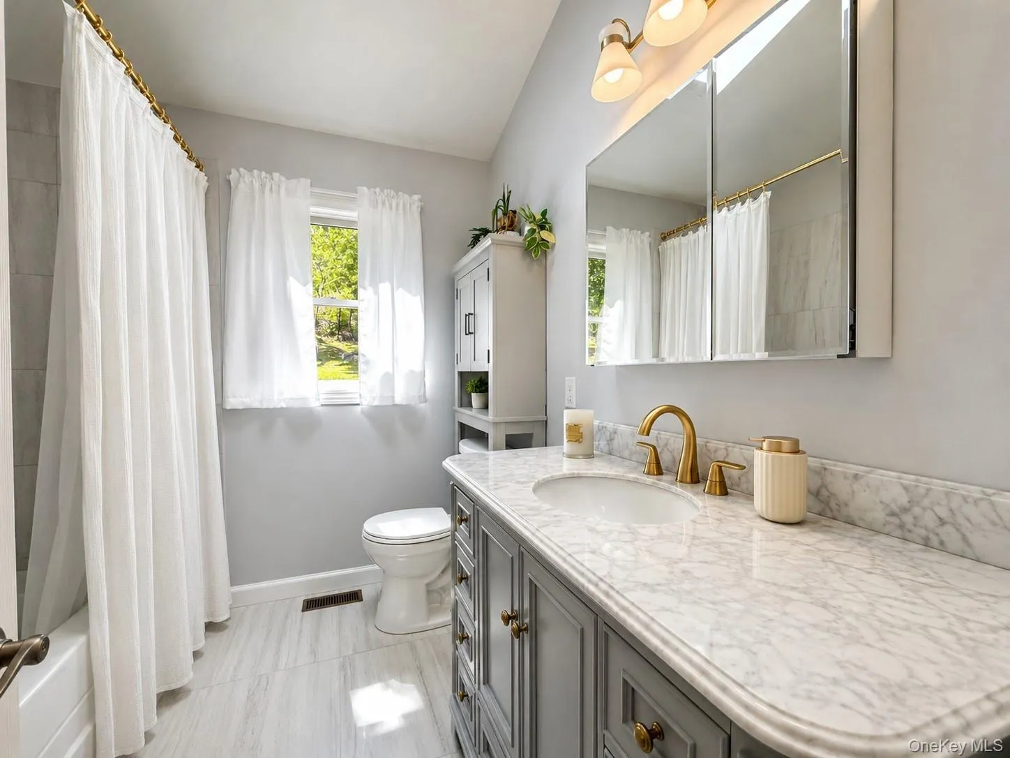 The primary bathroom offers a relaxing retreat with a comfortable soaking tub and the added luxury of heated radiant flooring for year-round comfort. The primary bathroom offers a relaxing retreat with a comfortable soaking tub and the added luxury of heated radiant flooring for year-round comfort.