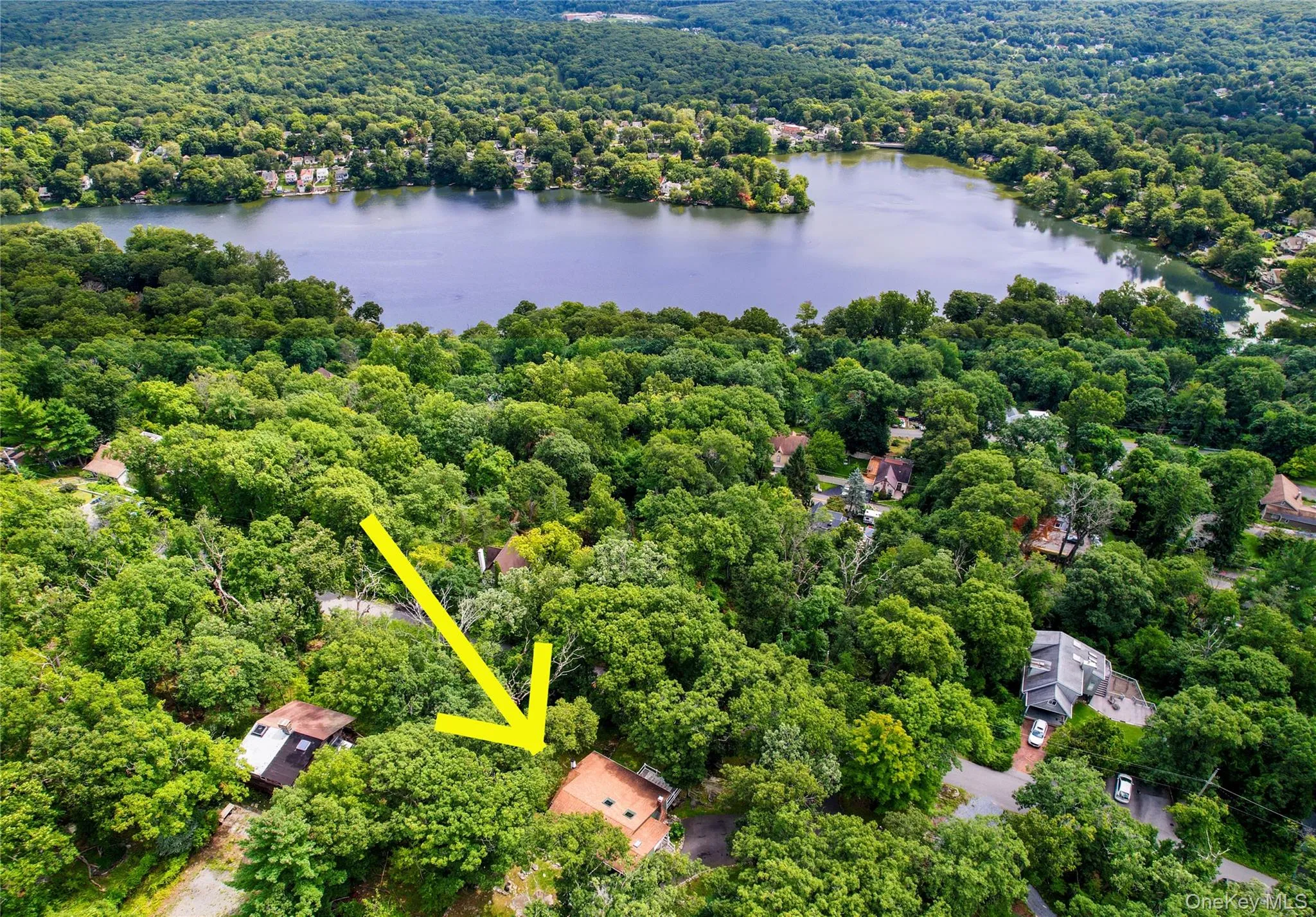 Take in the spectacular setting of Lake Peekskill from above, showcasing the beauty and charm of this picturesque location. Take in the spectacular setting of Lake Peekskill from above, showcasing the beauty and charm of this picturesque location.