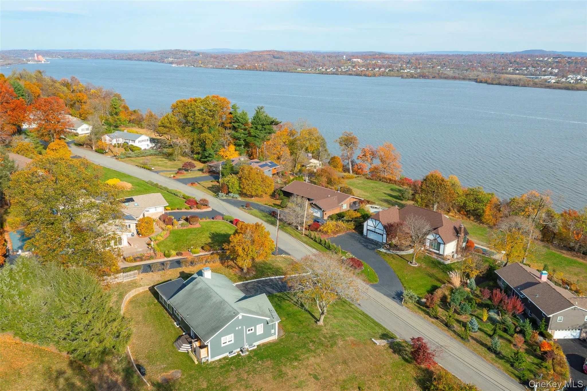 Aerial perspective of suburban area with a large body of water Aerial perspective of suburban area with a large body of water