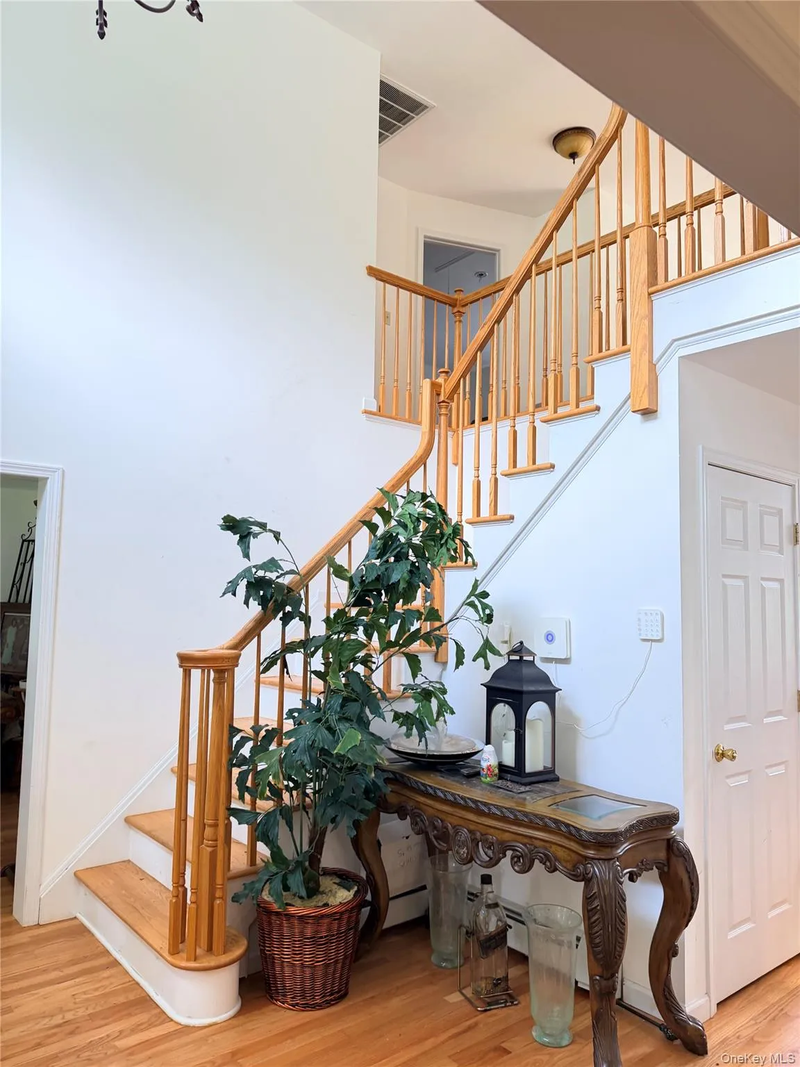 View of entry foyer featuring galley catwalk on second floor. View of entry foyer featuring galley catwalk on second floor.