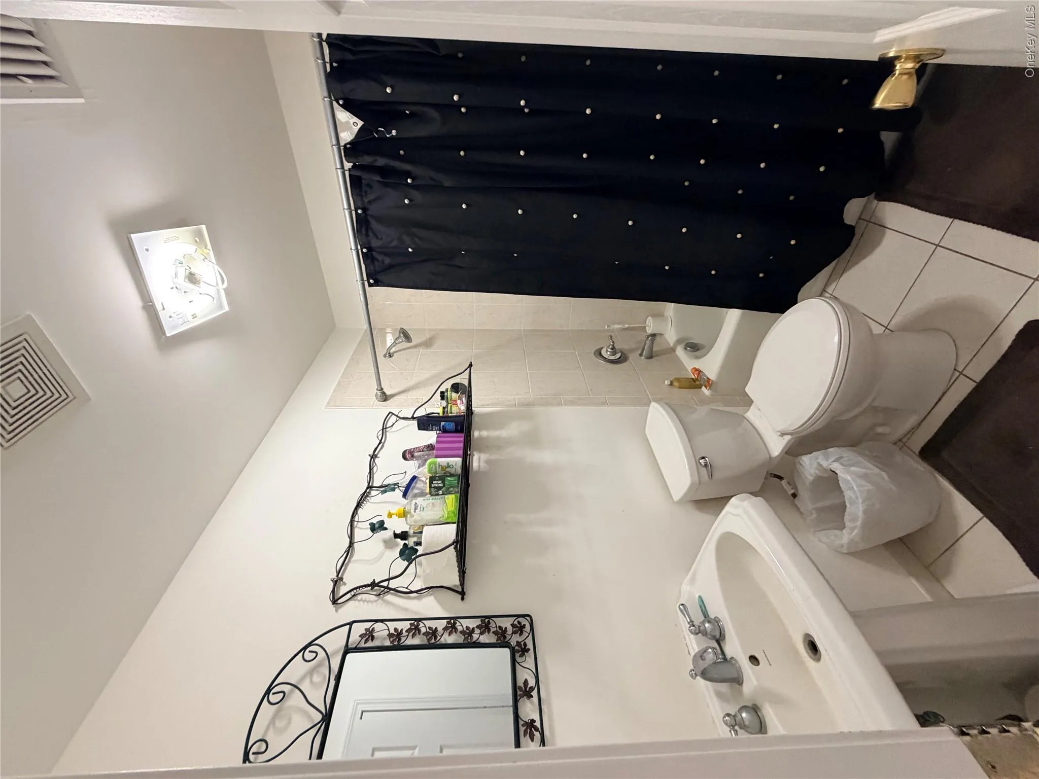 First floor bathroom. This bathroom has a door into the hallway as well as one into the adjoining office. First floor bathroom. This bathroom has a door into the hallway as well as one into the adjoining office.