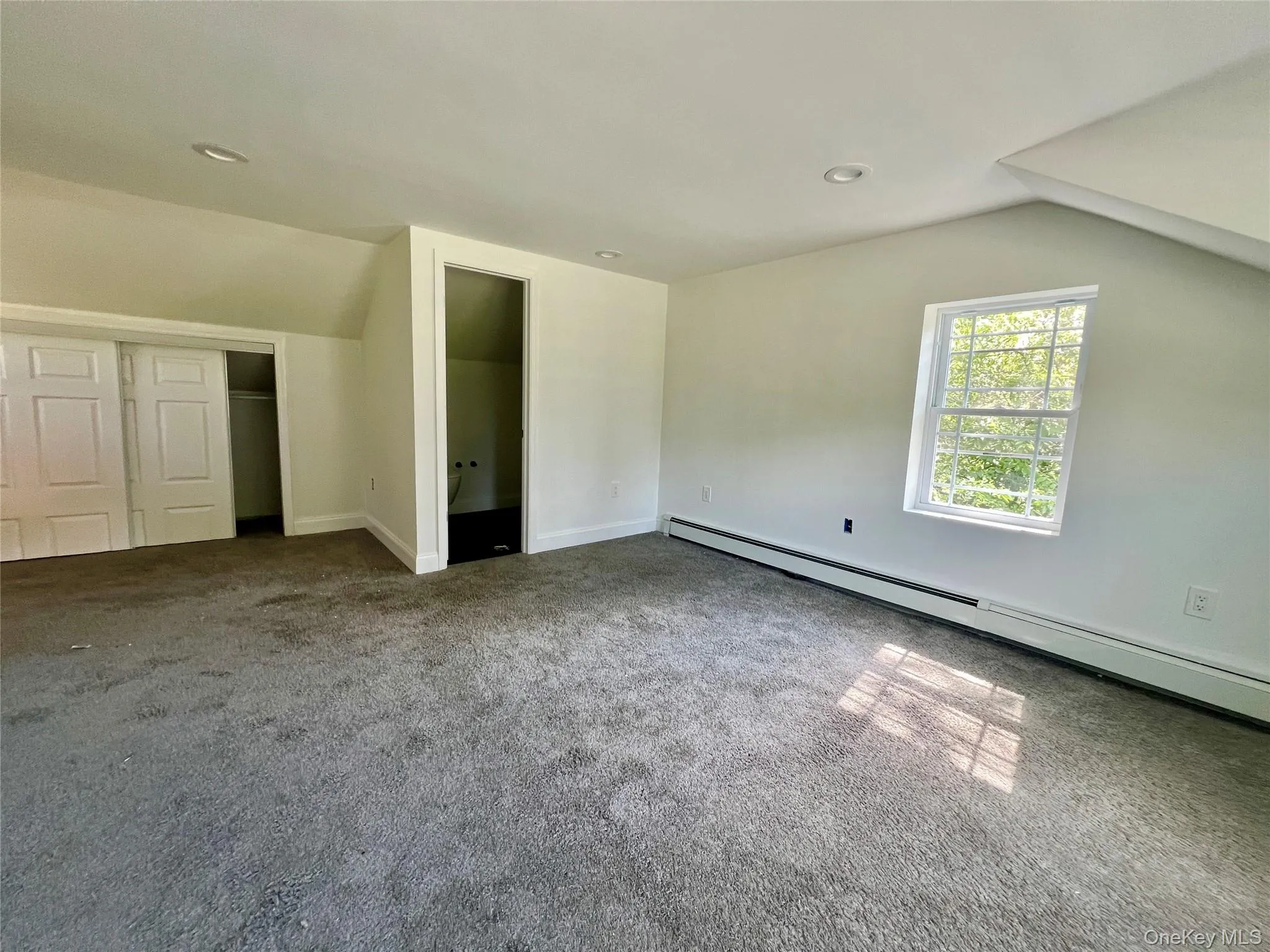 Bonus room with lofted ceiling, baseboard heating, carpet floors, and recessed lighting Bonus room with lofted ceiling, baseboard heating, carpet floors, and recessed lighting