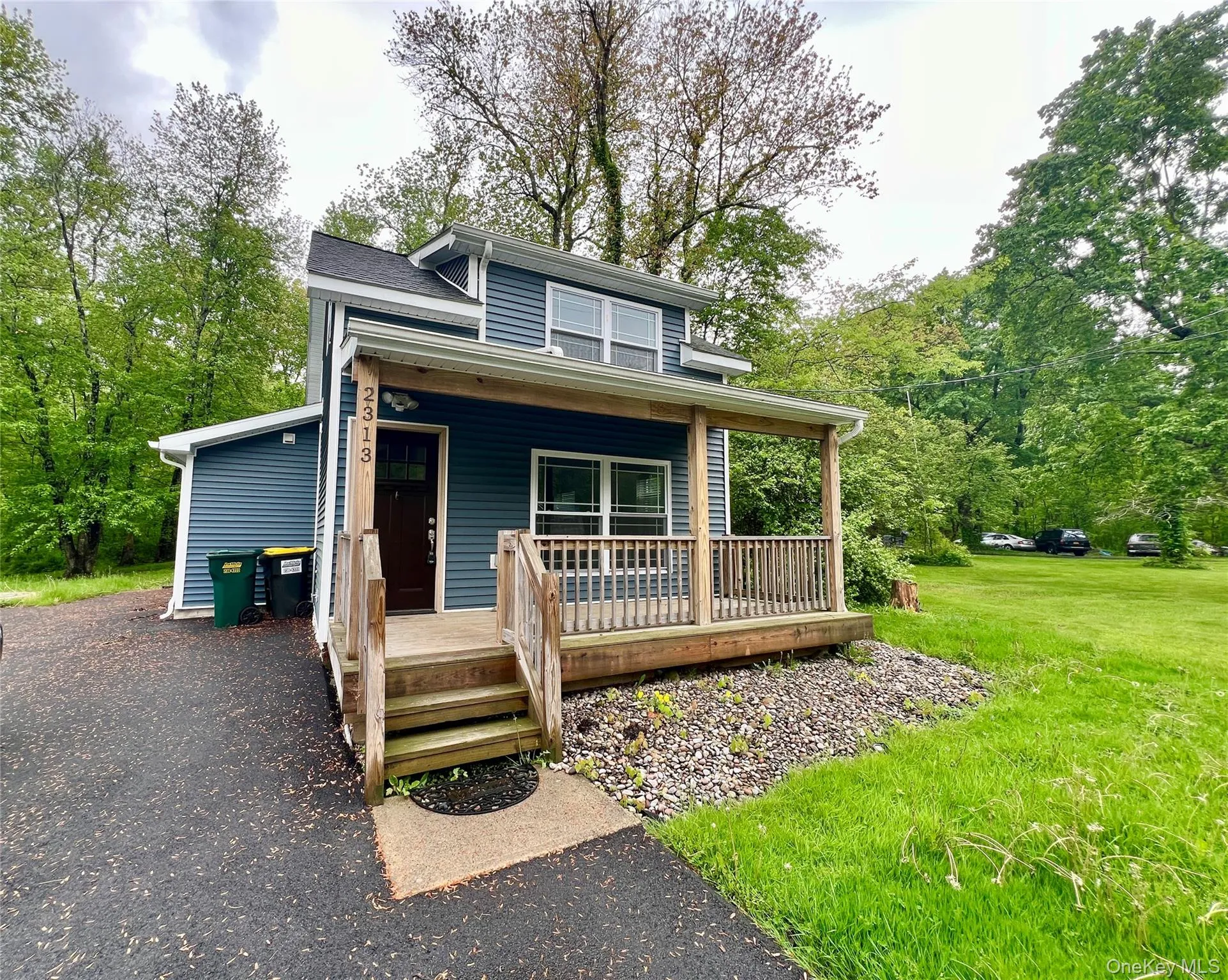 View of front of property featuring a porch and a front lawn View of front of property featuring a porch and a front lawn