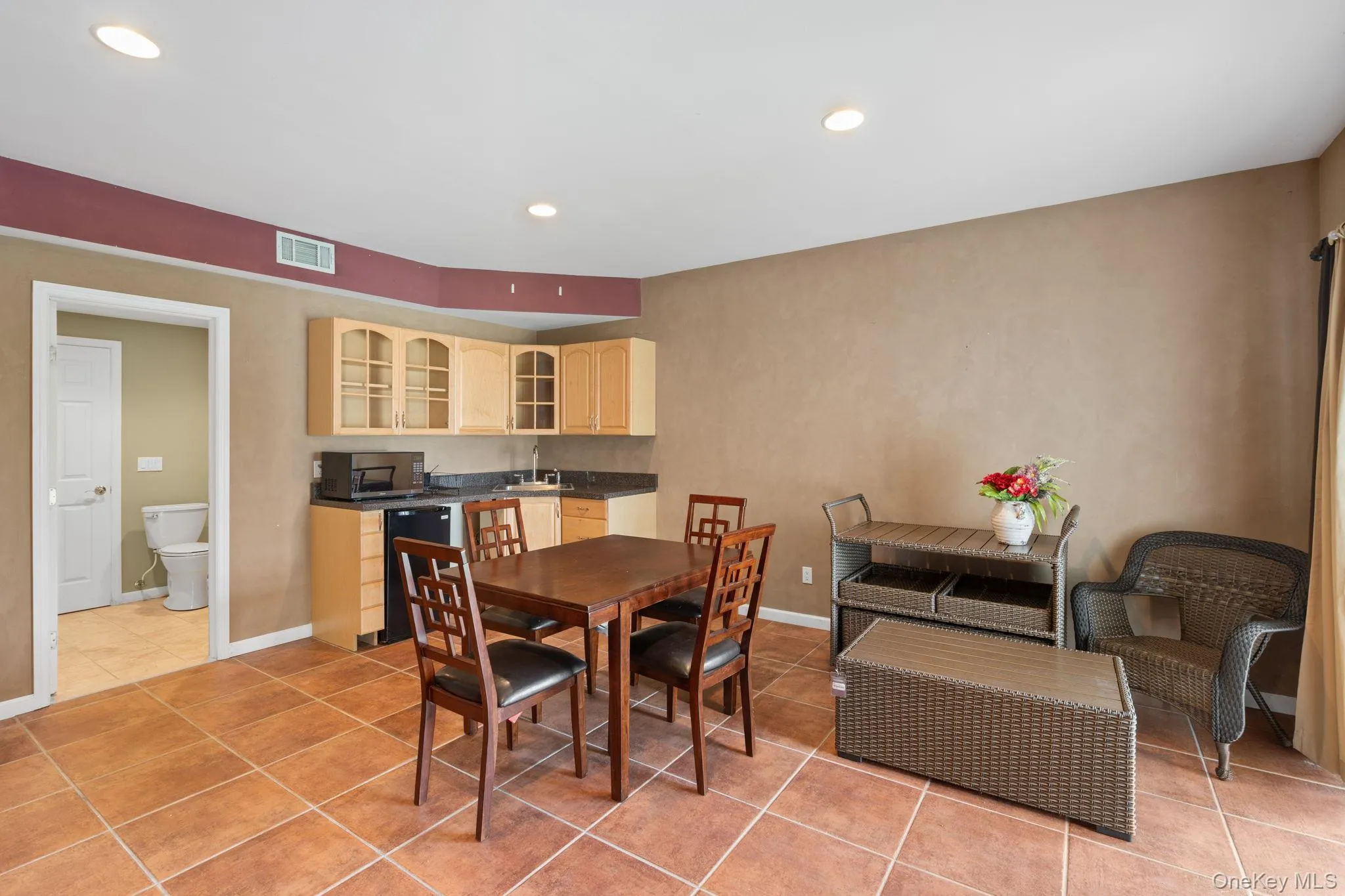 Dining area with light tile patterned floors and recessed lighting Dining area with light tile patterned floors and recessed lighting
