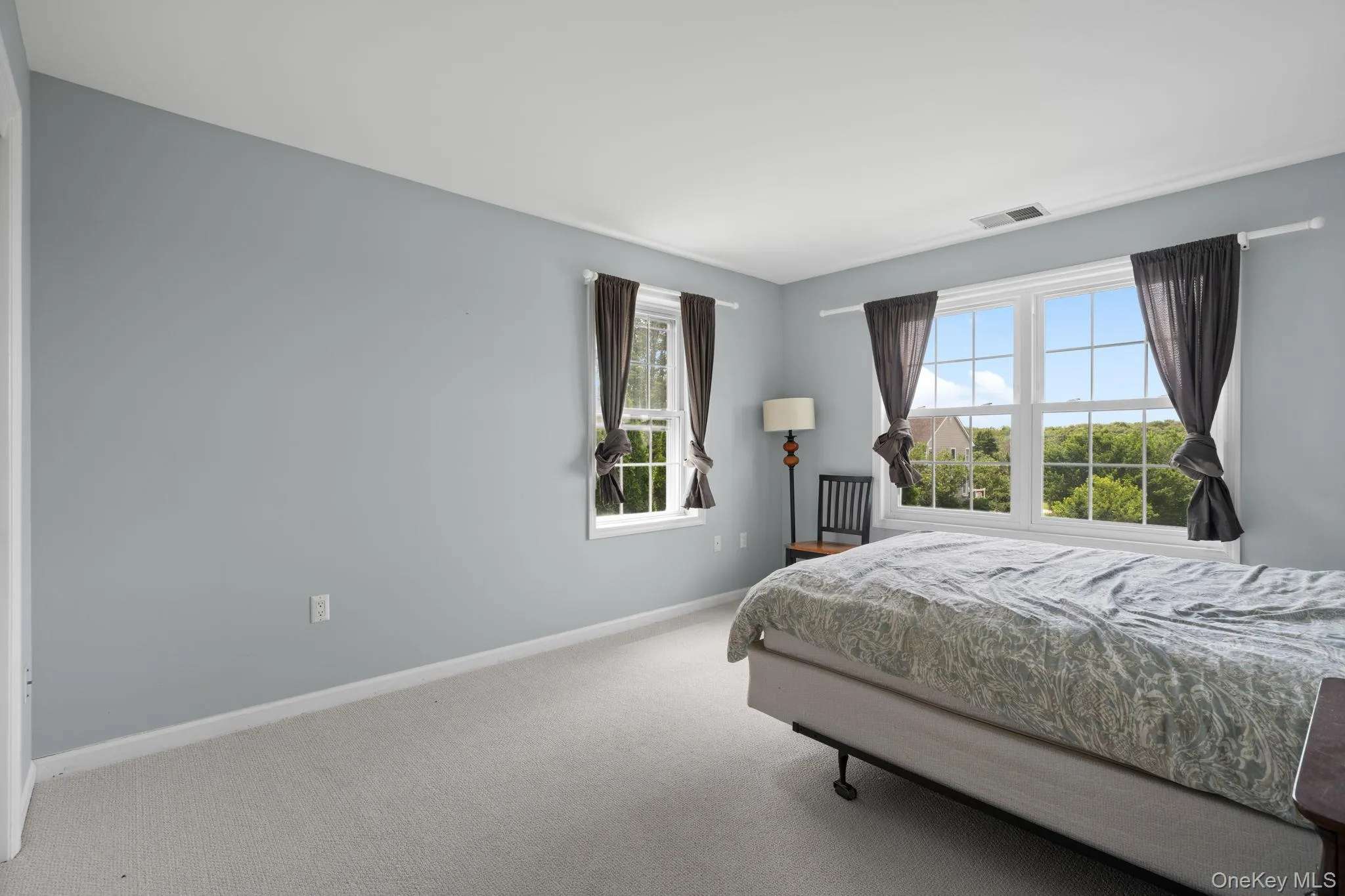 Carpeted bedroom with baseboards Carpeted bedroom with baseboards
