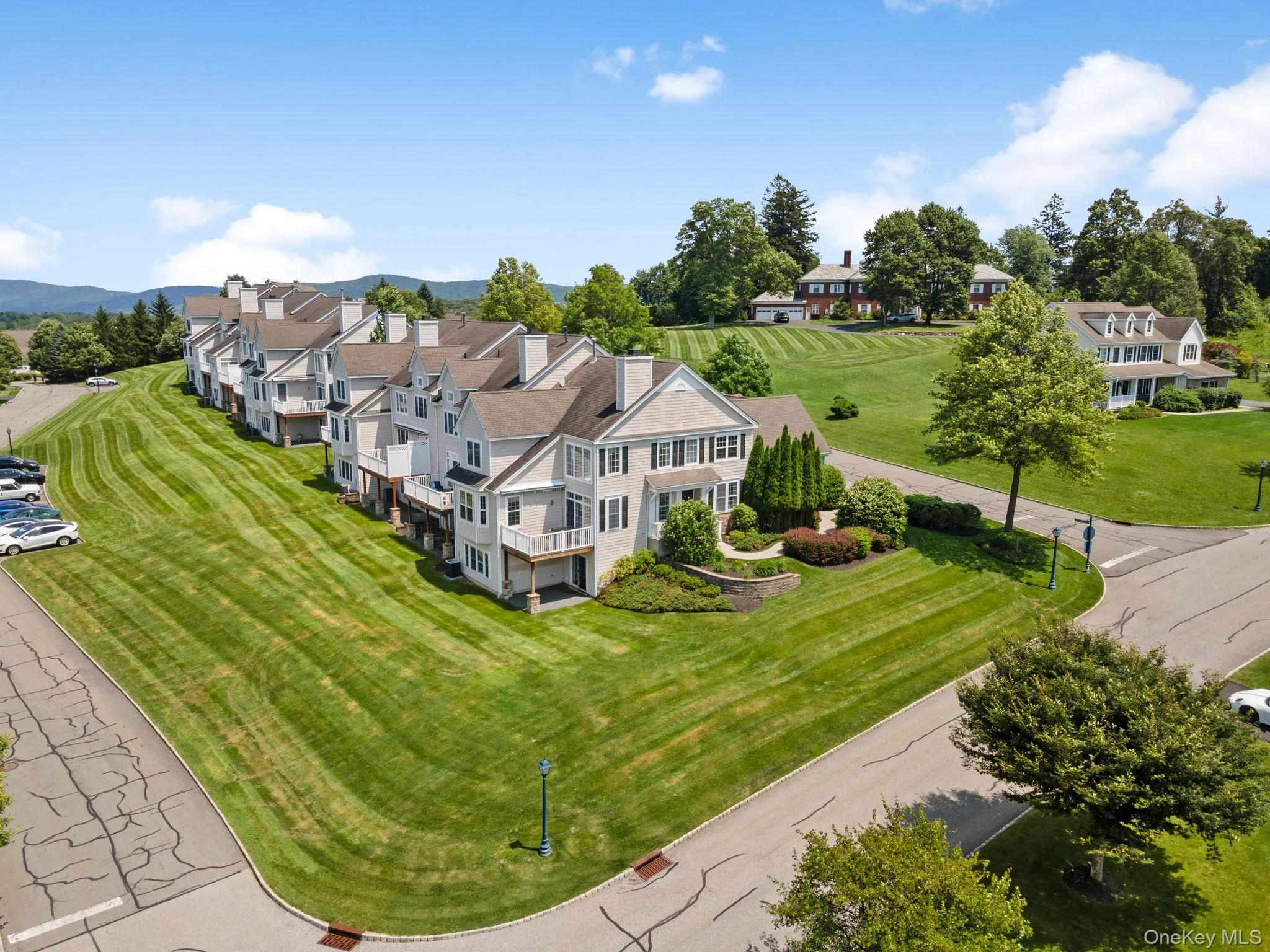Aerial perspective of suburban area with mountains Aerial perspective of suburban area with mountains