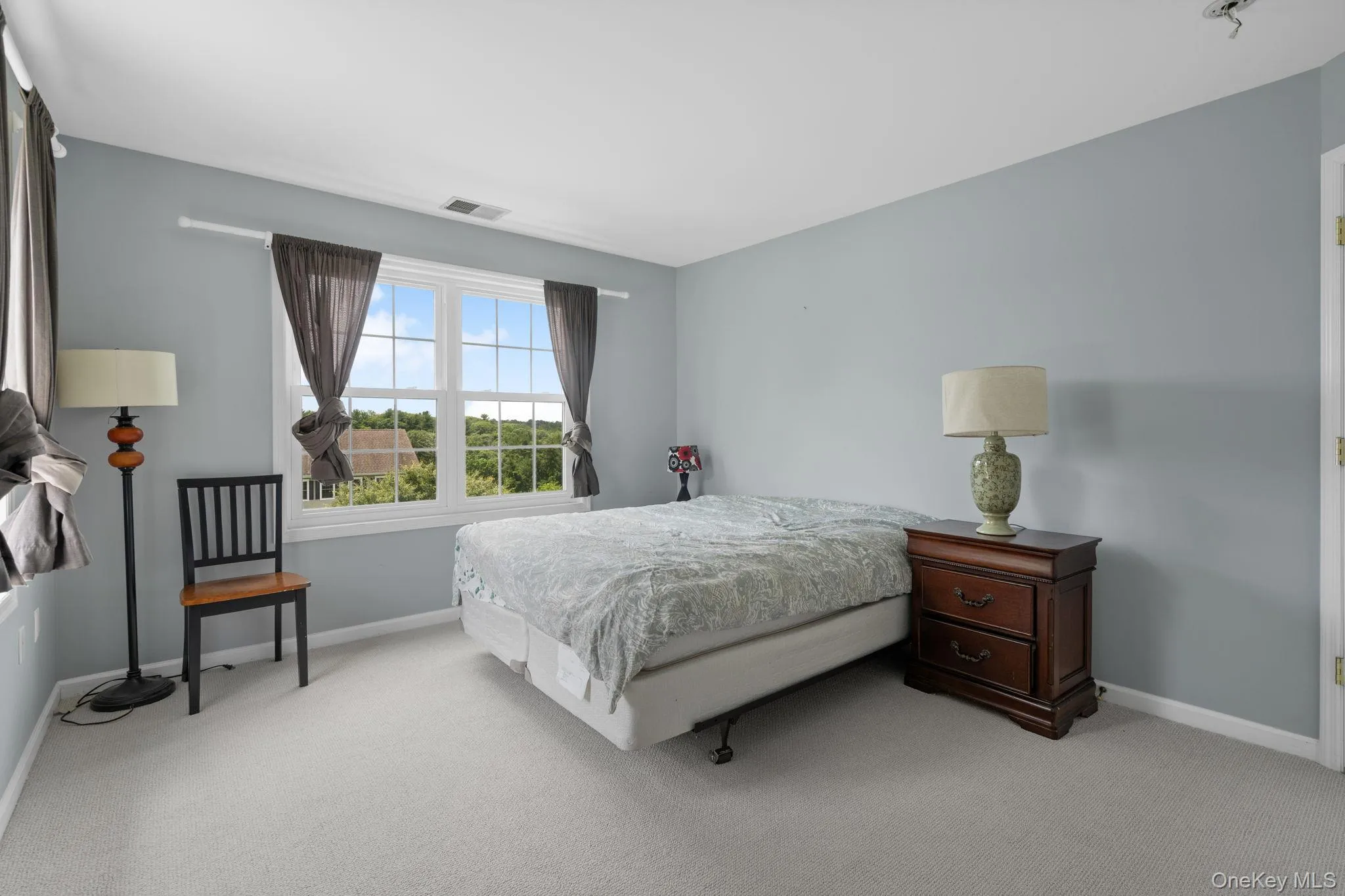 Carpeted bedroom featuring baseboards Carpeted bedroom featuring baseboards